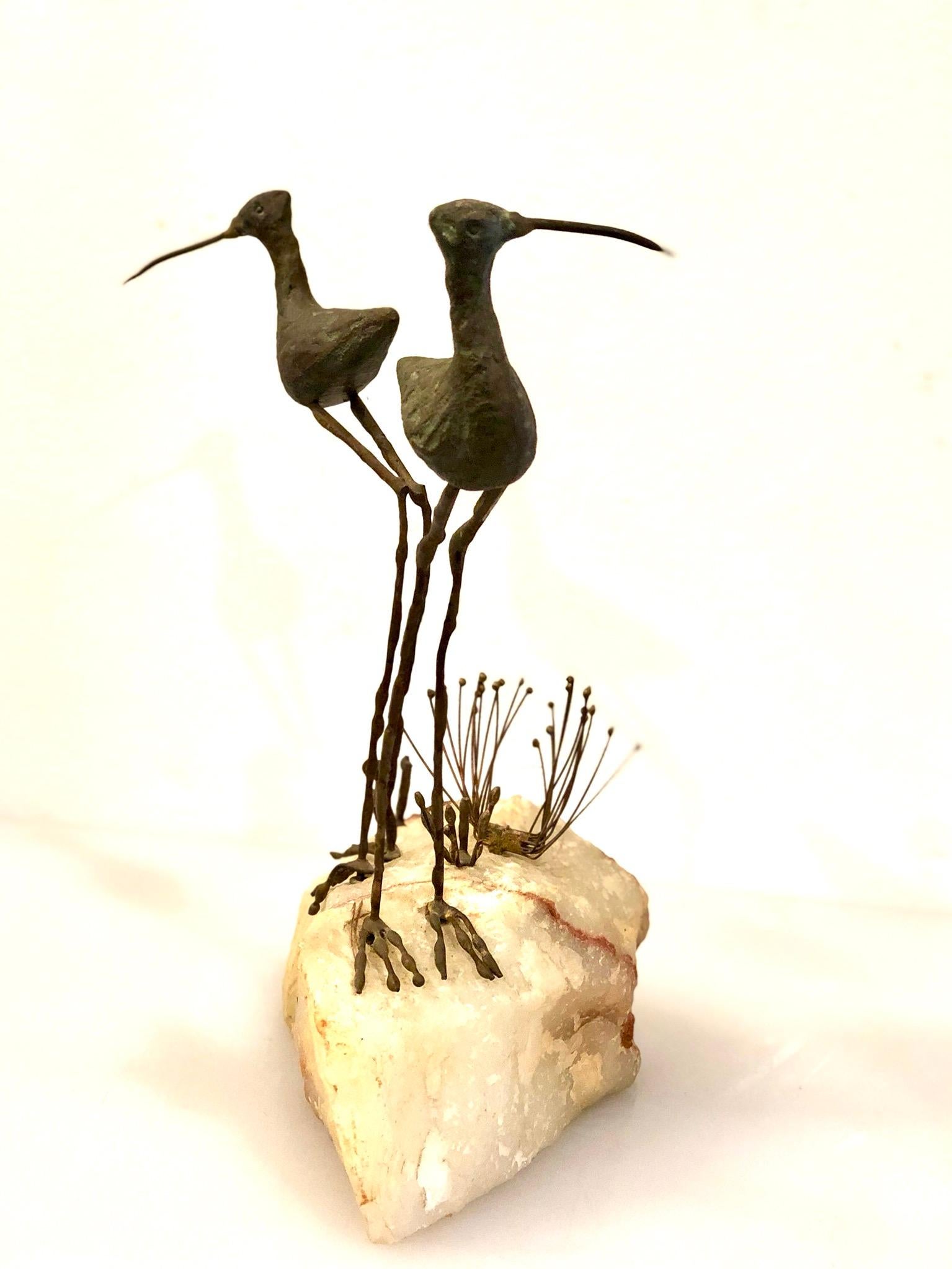 Whimsical pair of bronze birds sculpture sitting on a solid block of white quartz by Curtis Jere, circa 1968. The piece is signed 