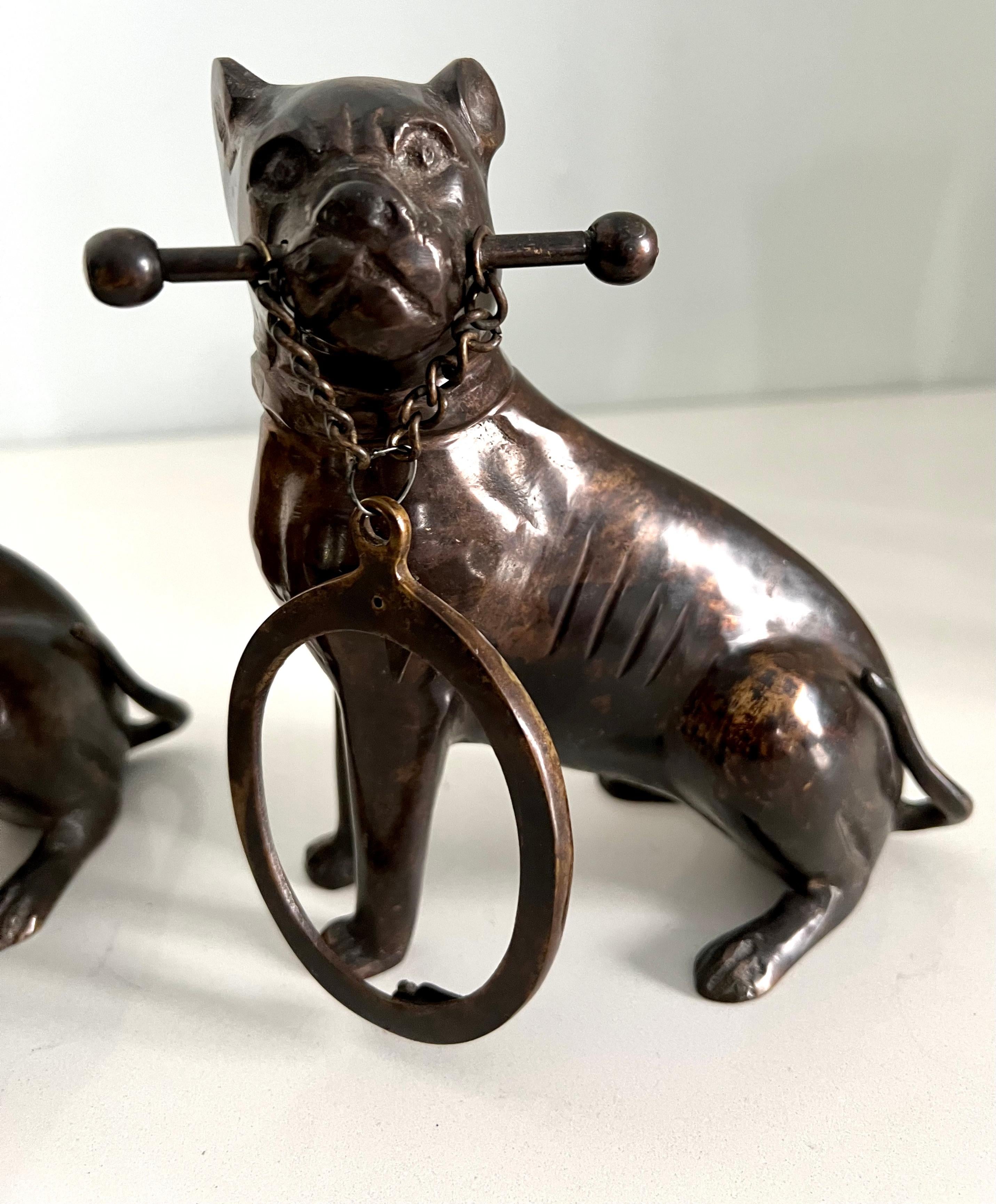 Pair of Bronze Boxer Dog Bookends Holding an Oval Picture Frame For Sale 1