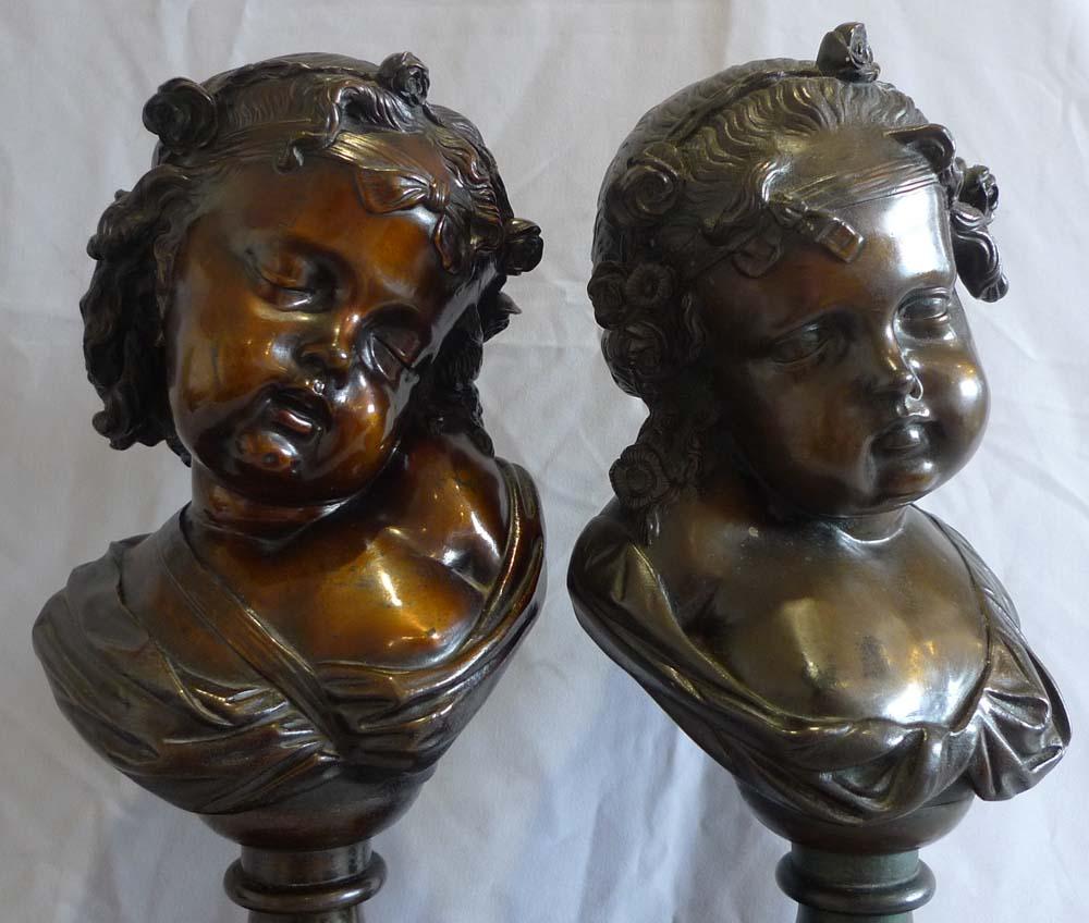 French  Pair of bronze busts of childs' heads on marble bases. For Sale