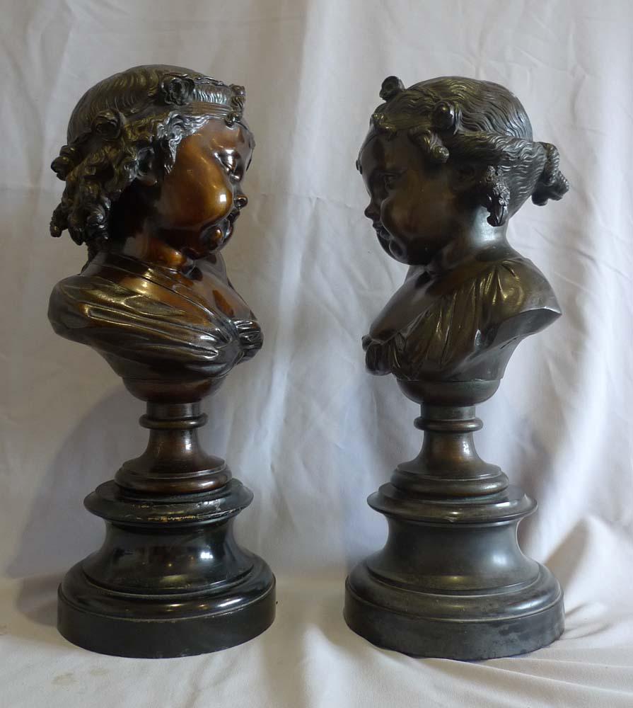 Late 19th Century  Pair of bronze busts of childs' heads on marble bases. For Sale
