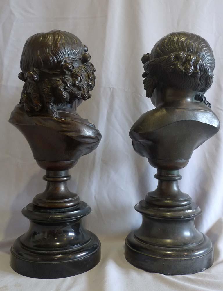 Bronze  Pair of bronze busts of childs' heads on marble bases. For Sale