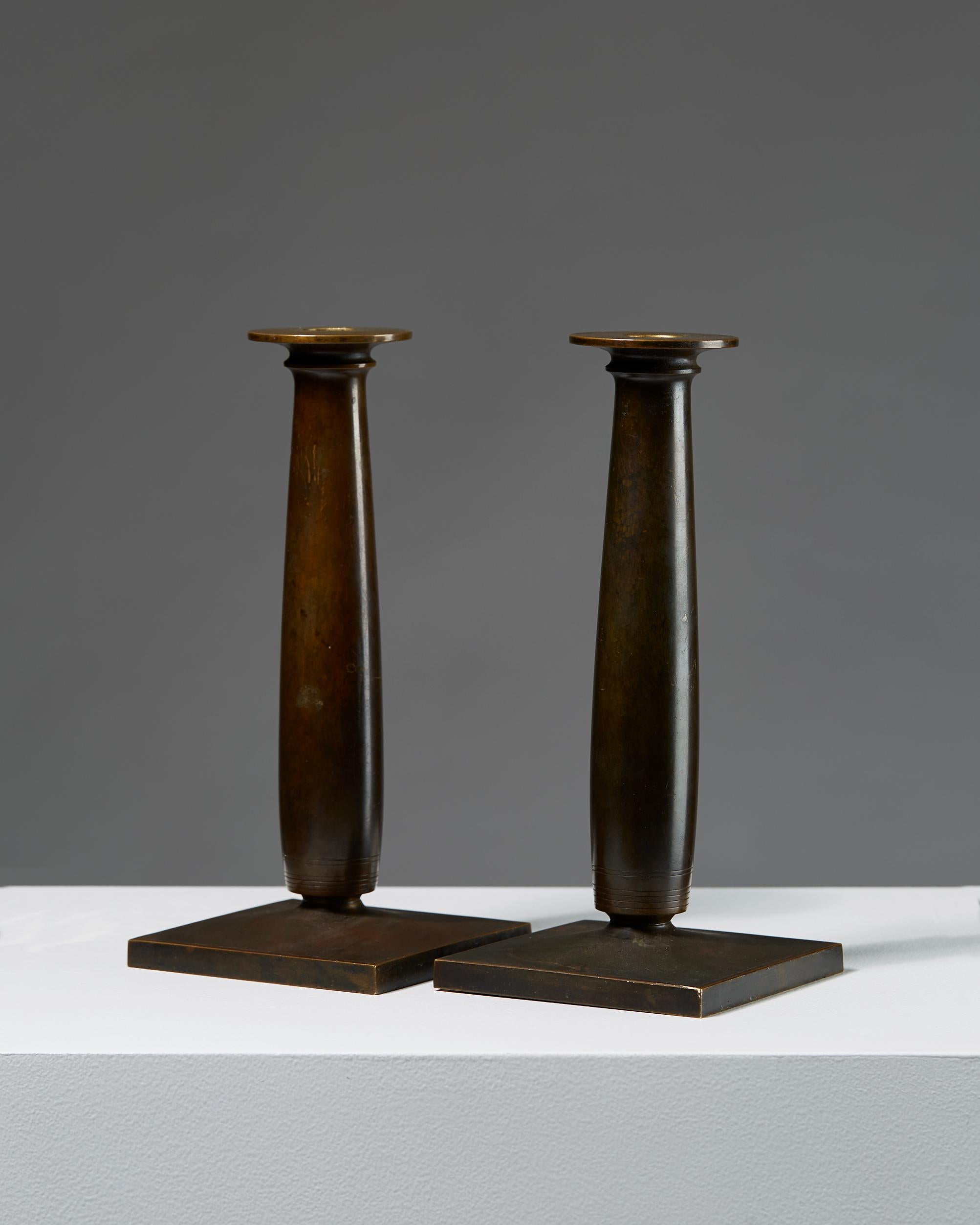 Scandinavian Modern Pair of Bronze Candle Holders Designed by Just Andersen, Denmark. 1920s