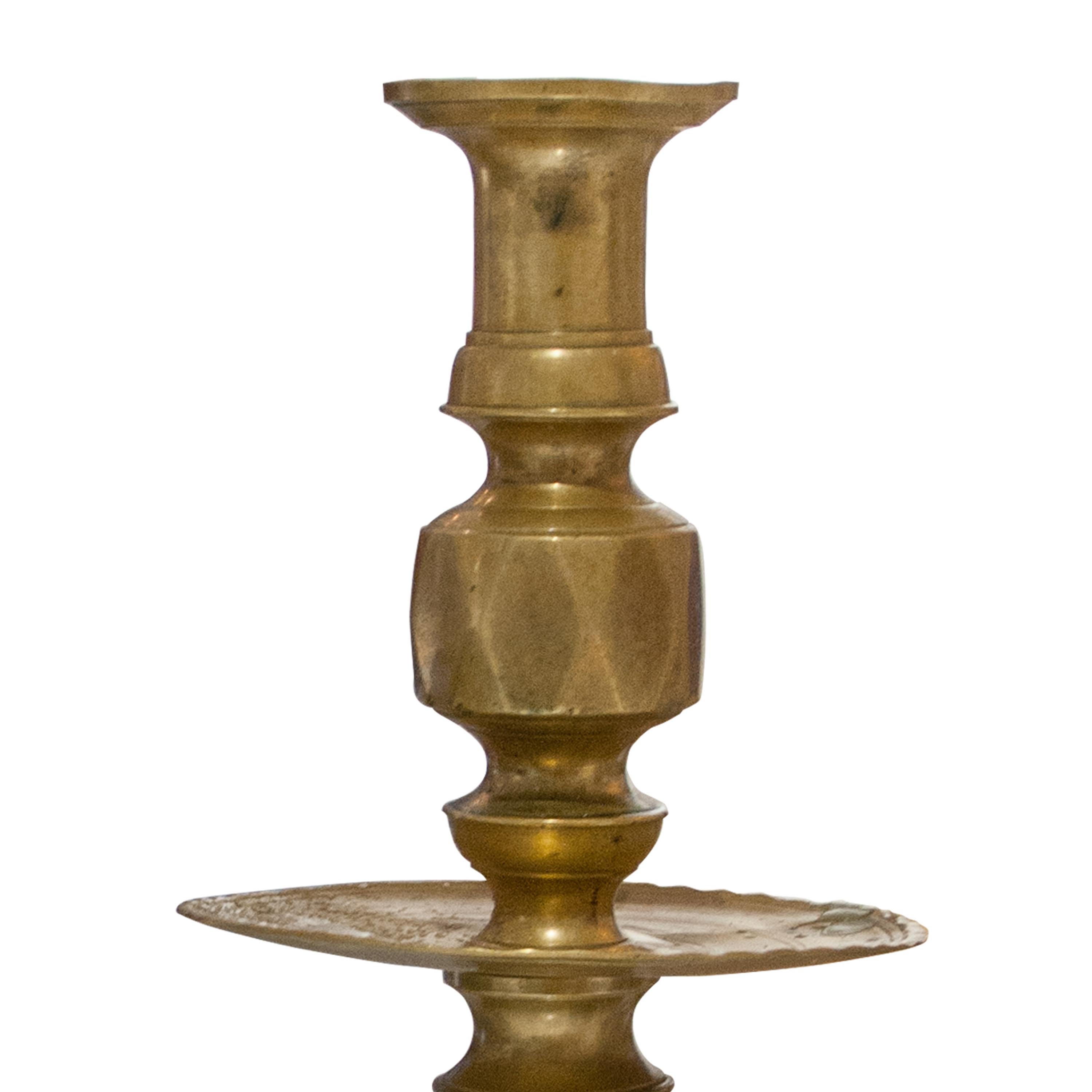 Pair of candle holders made of solid bronze.
