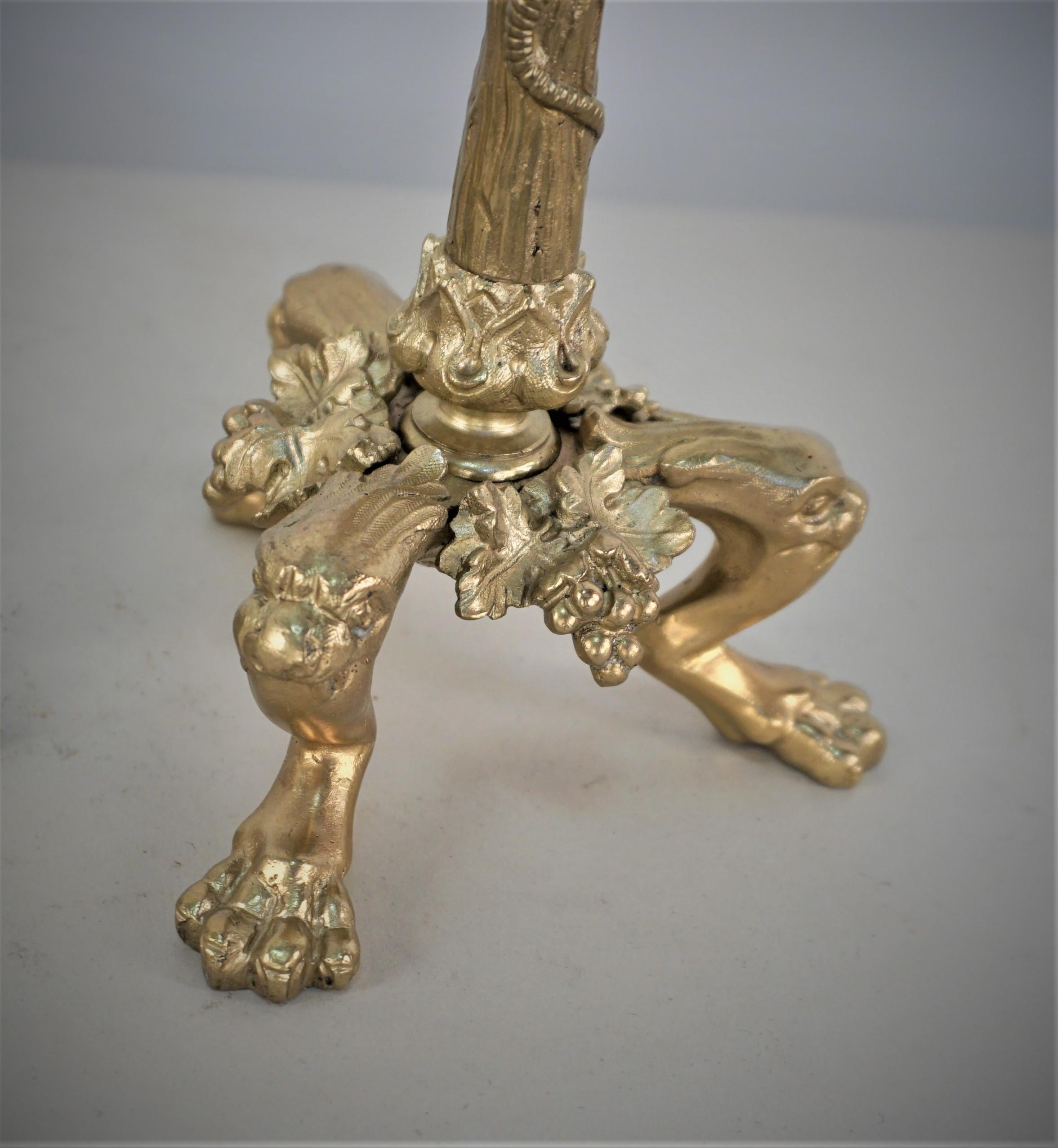 Pair of 19th century bronze candlesticks with lizard claiming up.