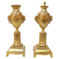 Pair of Bronze Candlesticks Decorated with Rams Heads