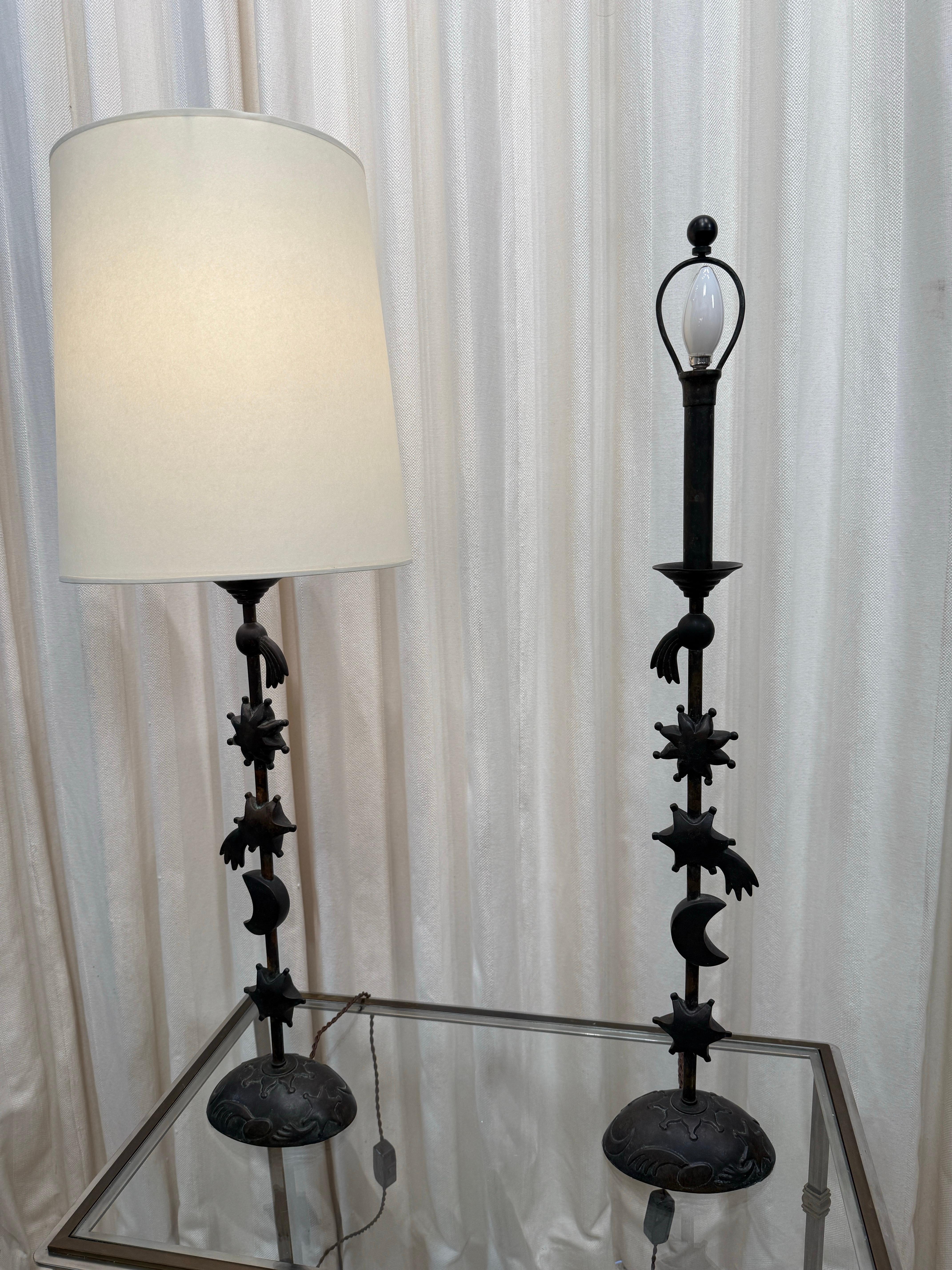 These are a whimsical pair of heavy bronze tall lamps depicting a comet, star, moon, sun and shooting star.  The custom paper shades shown are NEW and included with the purchase price.  Newly rewired with silk twisted cable.
