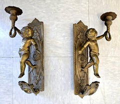 Pair of Bronze Cherub Figural Candle Sconces