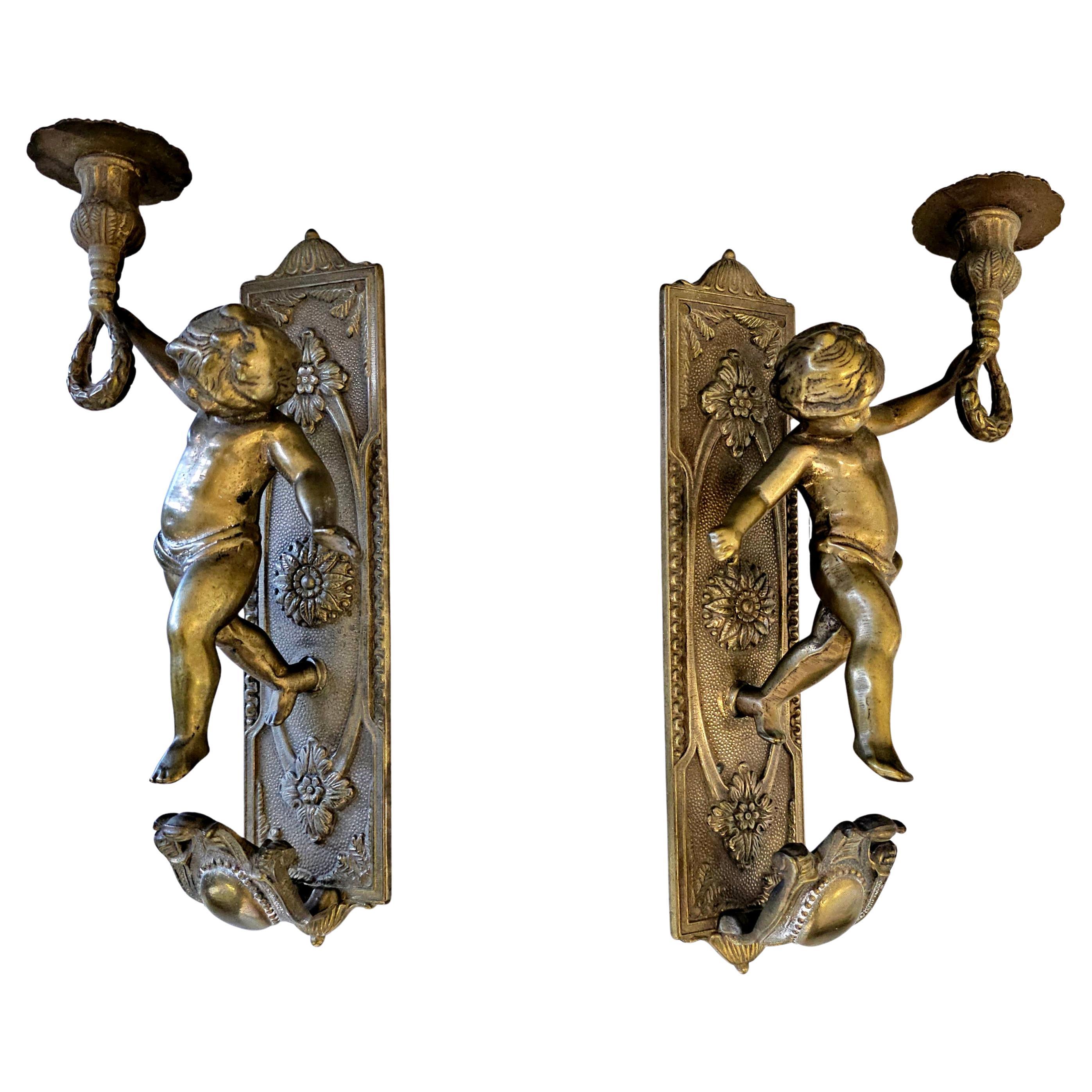 Pair of Bronze Cherub Figural Candle Sconces