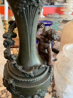 Pair of Bronze Cherub Ornamental Vases
