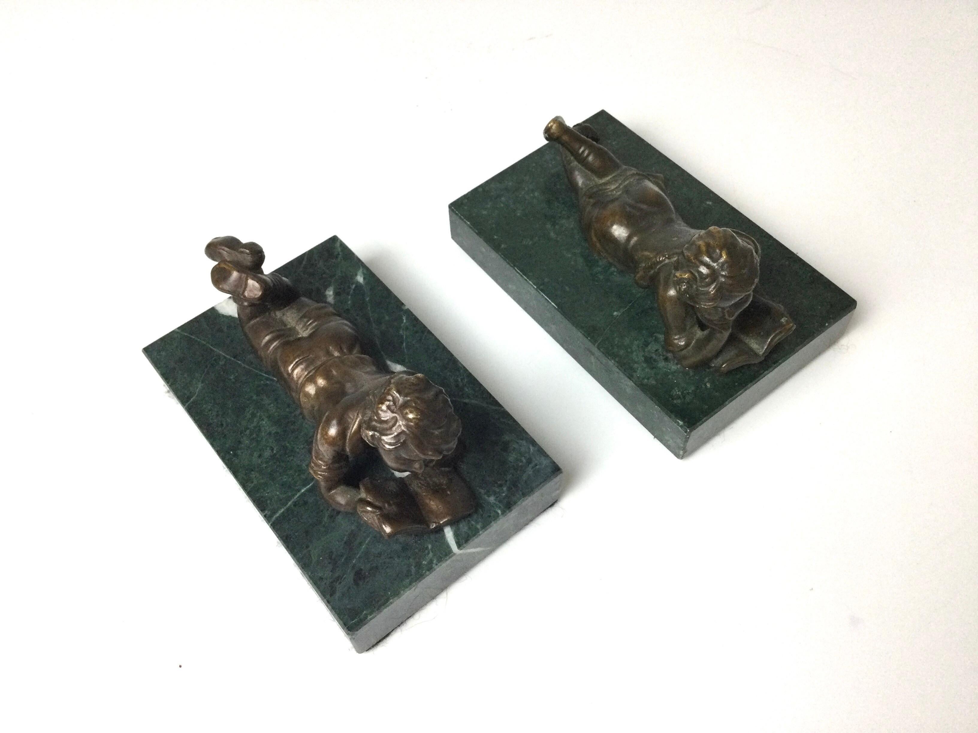 Pair of bronze children reading on green marble bases. Could be used as bookends. Each are 4 1/2