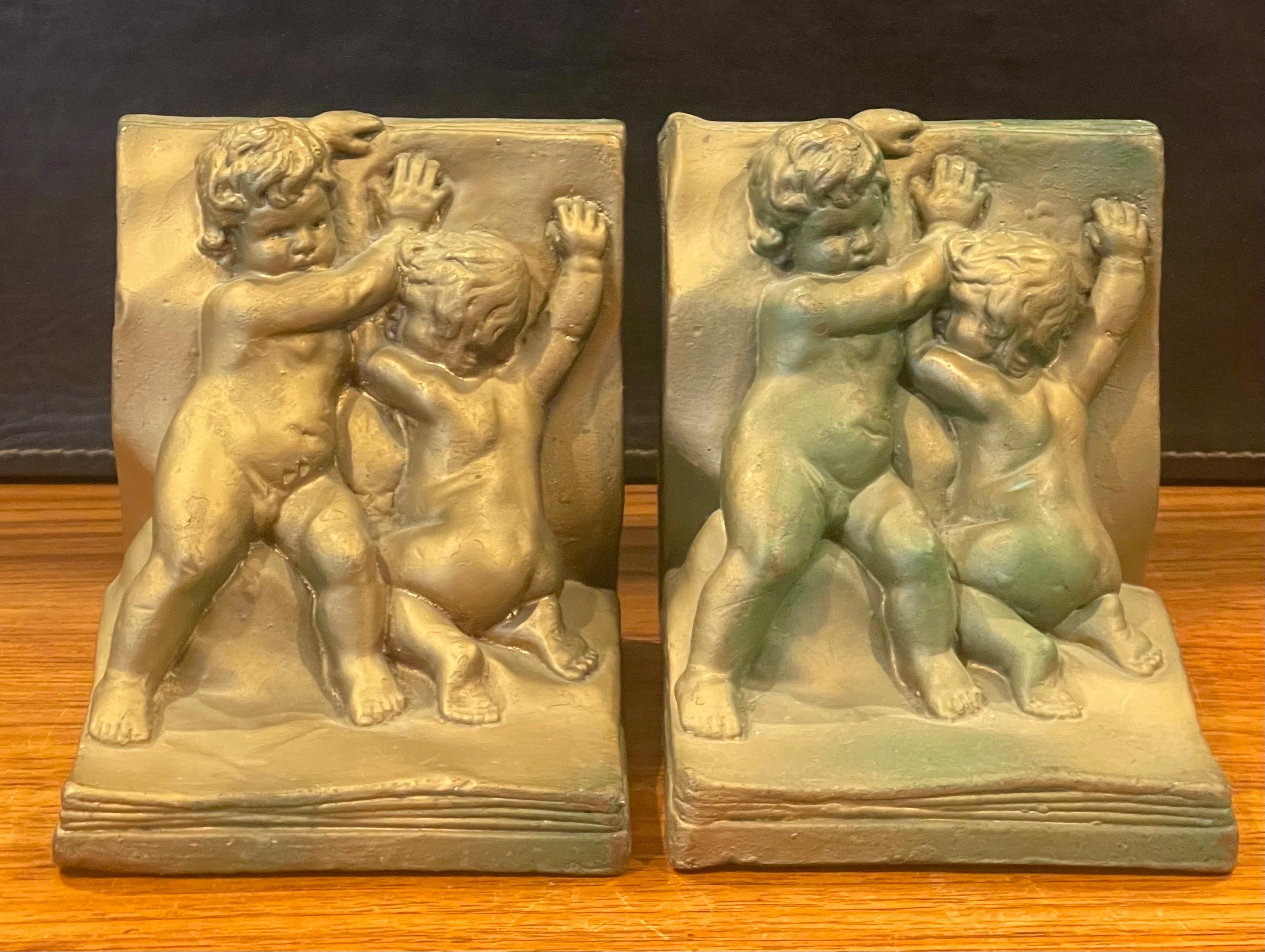Pair of Bronze Clad Cherub Art Deco Bookends by Art Bronze In Good Condition For Sale In San Diego, CA