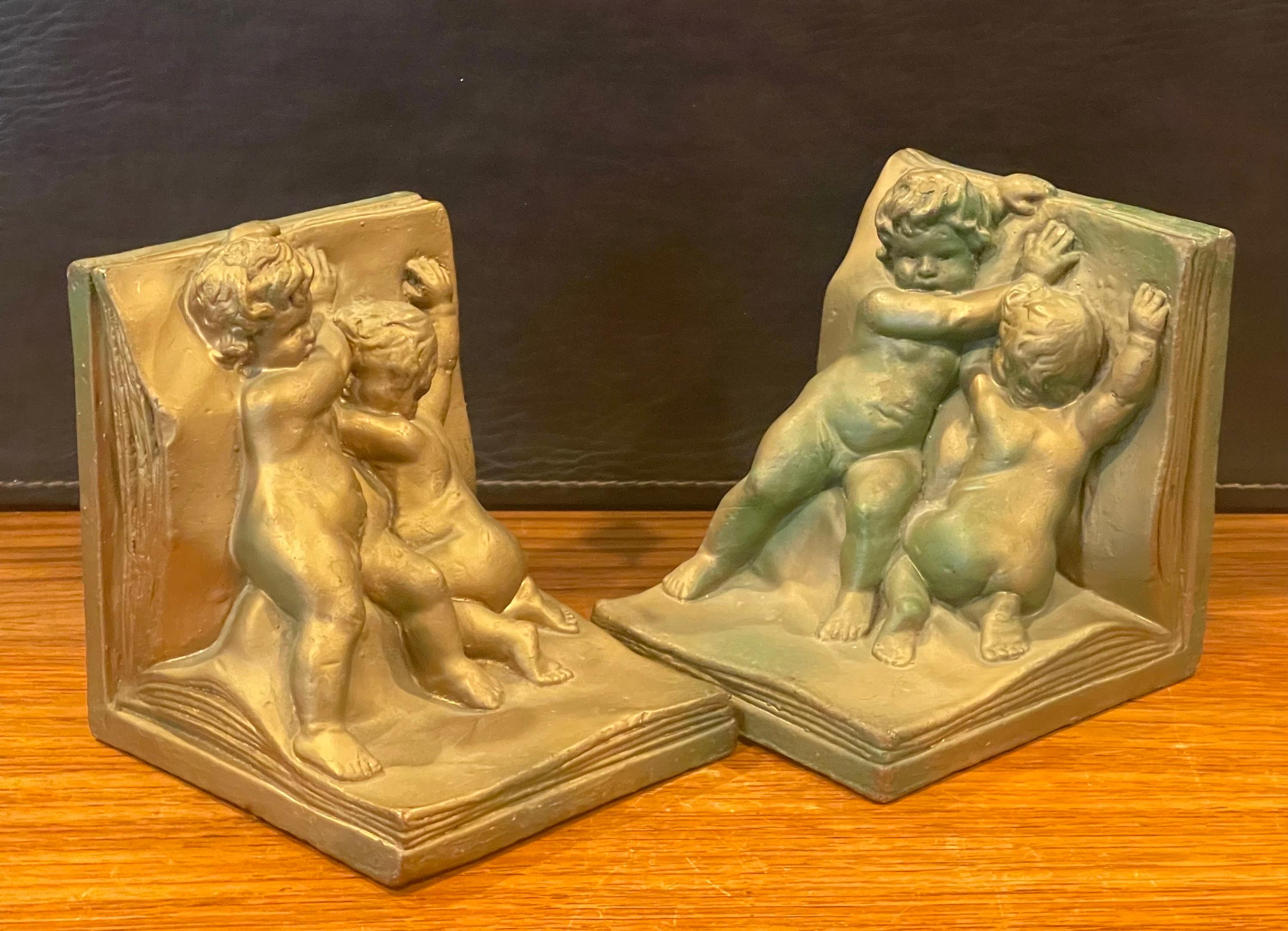 20th Century Pair of Bronze Clad Cherub Art Deco Bookends by Art Bronze For Sale