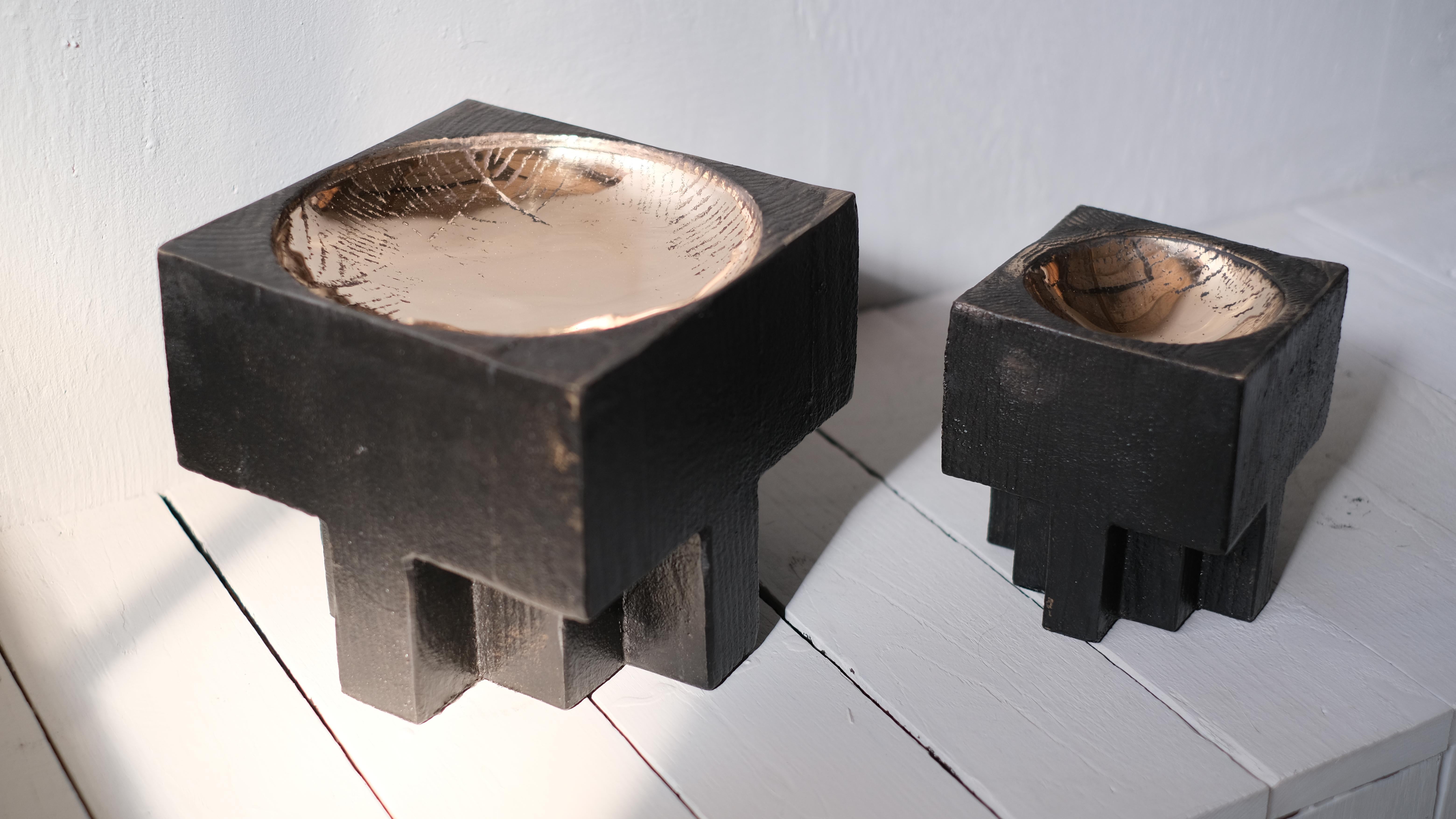 Pair of bronze cross pots - Signed Arno Declercq
Sand casted in pink bronze and hand polished. 
Measures: small 11 cm wide x 11 cm long x 14 cm high / 4.5” wide x 4.5” long x 5” high
Large 19 cm wide x 19 cm long x 17 cm high / 7.5” wide x 7.5”