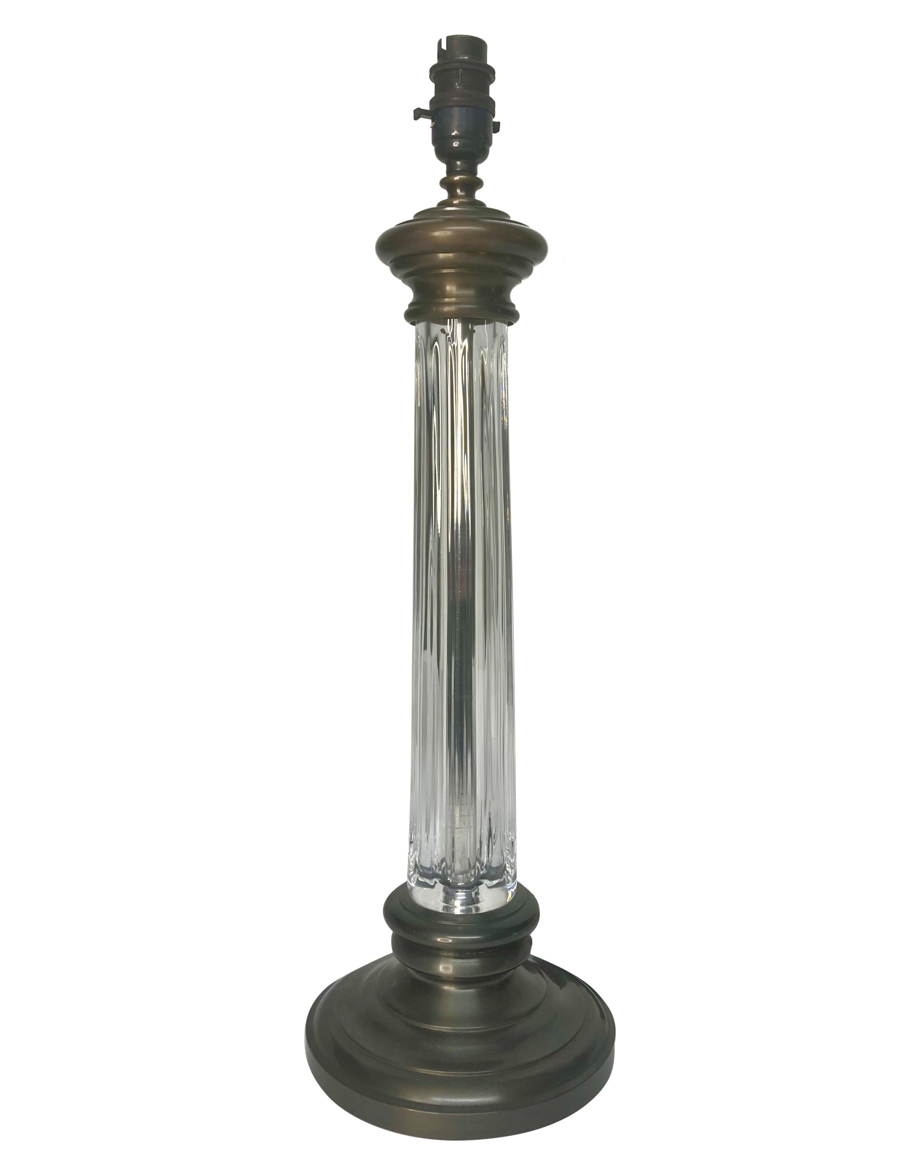 A pair of English cut glass column lamps with bronzed bases and fittings. Newly electrified with brown silk cords.