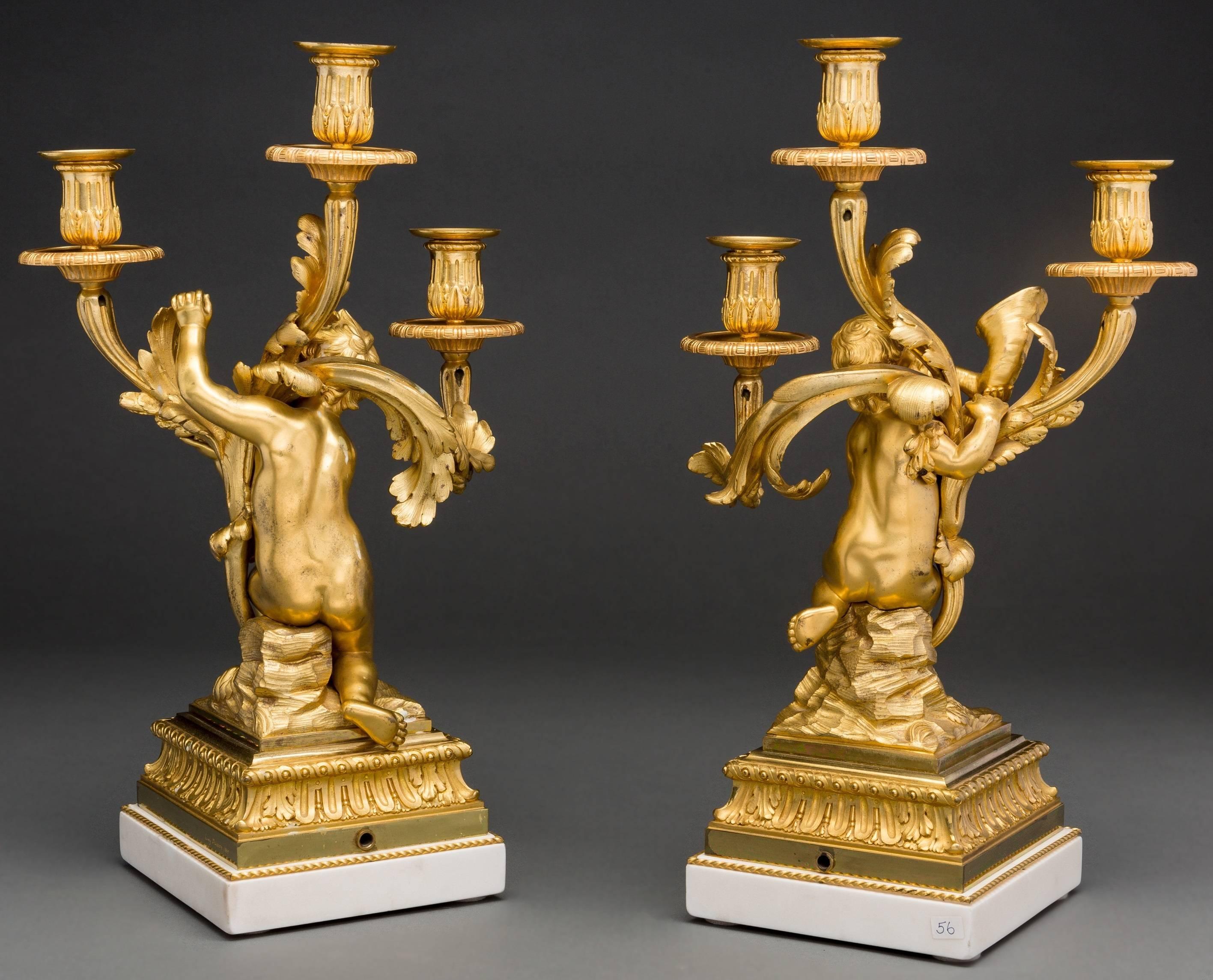 Pair of finest quality French 19 century Louis XVI style doré bronze and white marble cherub motif candelabras.
Signed: Henry Dasson.