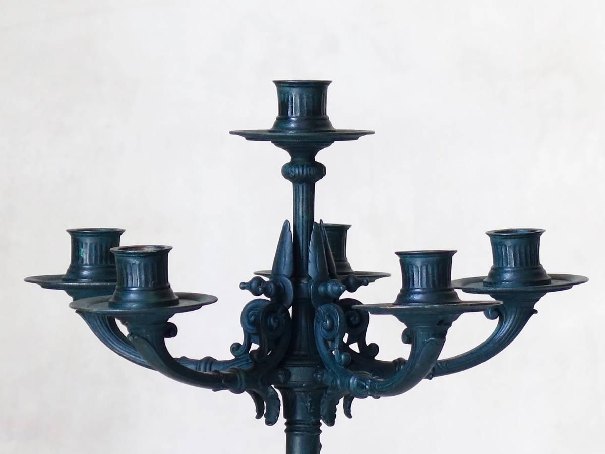 Elegant pair of bronze Empire style candelabras with fine details, raised on paw feet. Beautifully oxidized Verdigris patina.