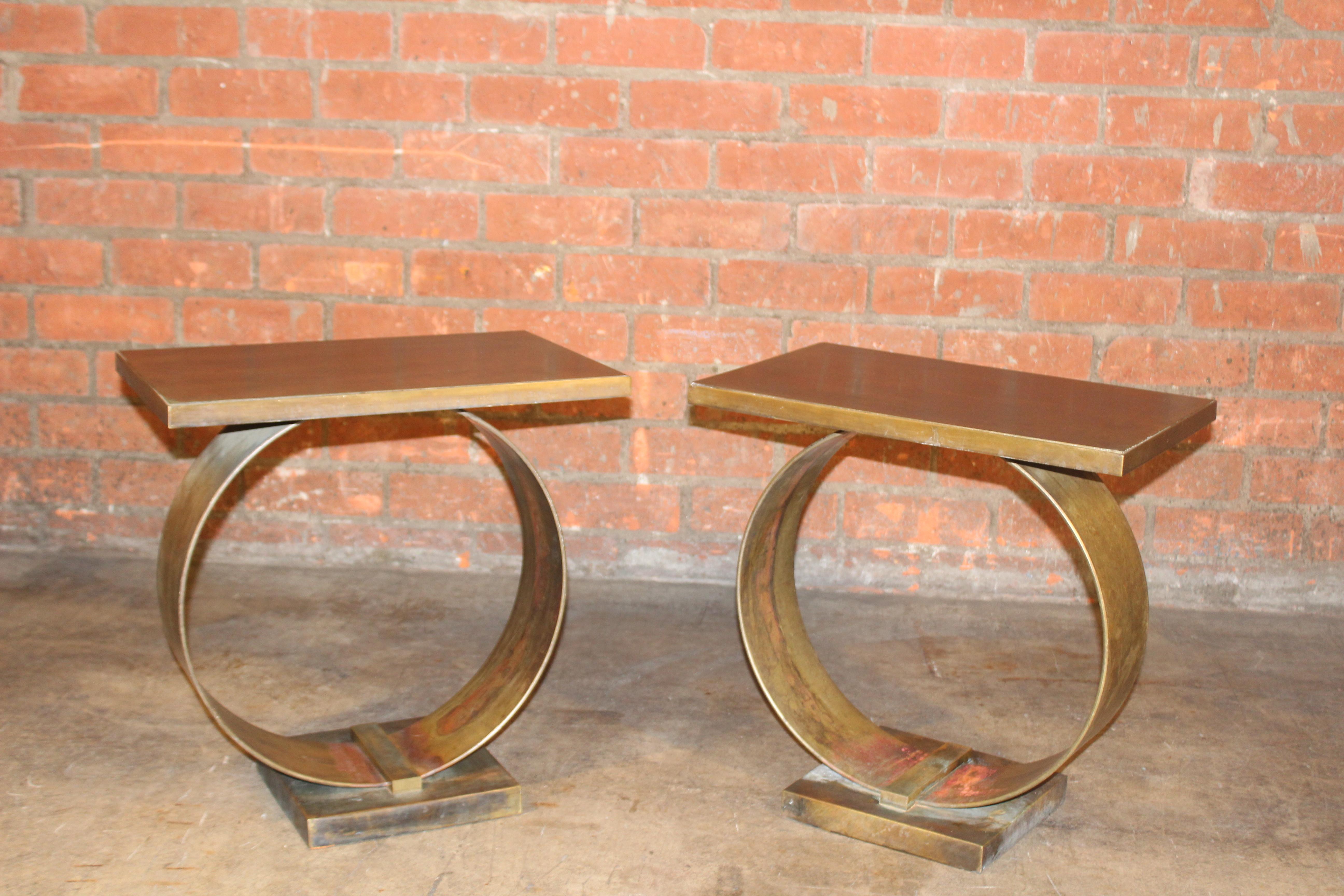 Pair of vintage bronze end tables. In good condition with a wonderful patina.