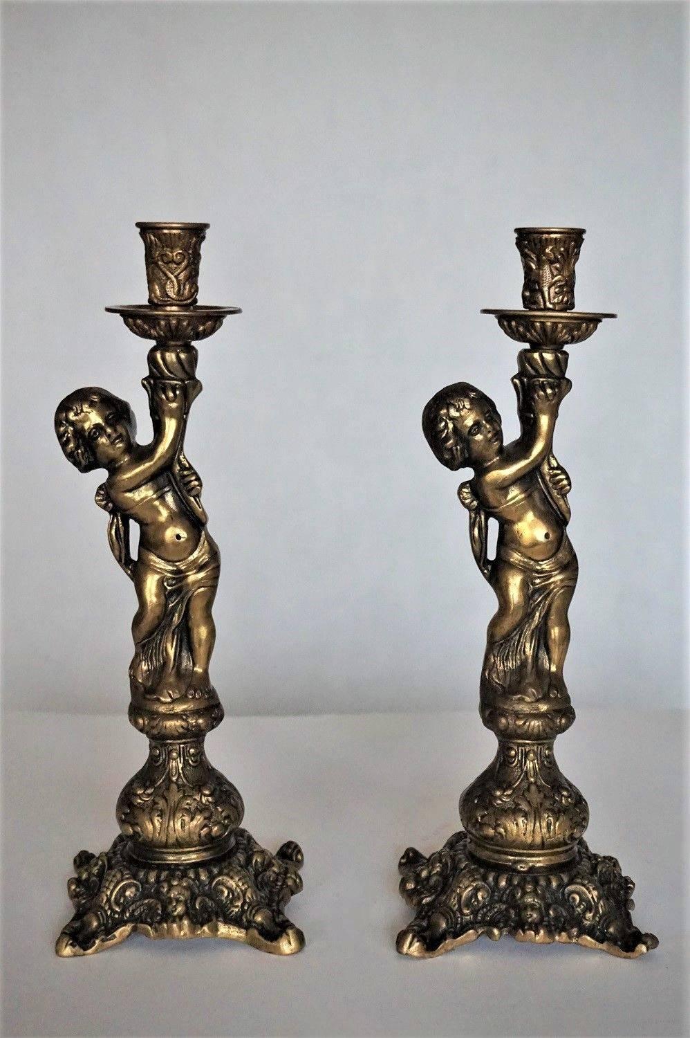 A lovely pair of solid bronze putti candlesticks richly decorated, circa 1920

Measures: Height 13 in (32.5 cm)
Width/depth 4.50 in (11 cm)
Weight 3 lb. each candelabra (1.500 kg).

 