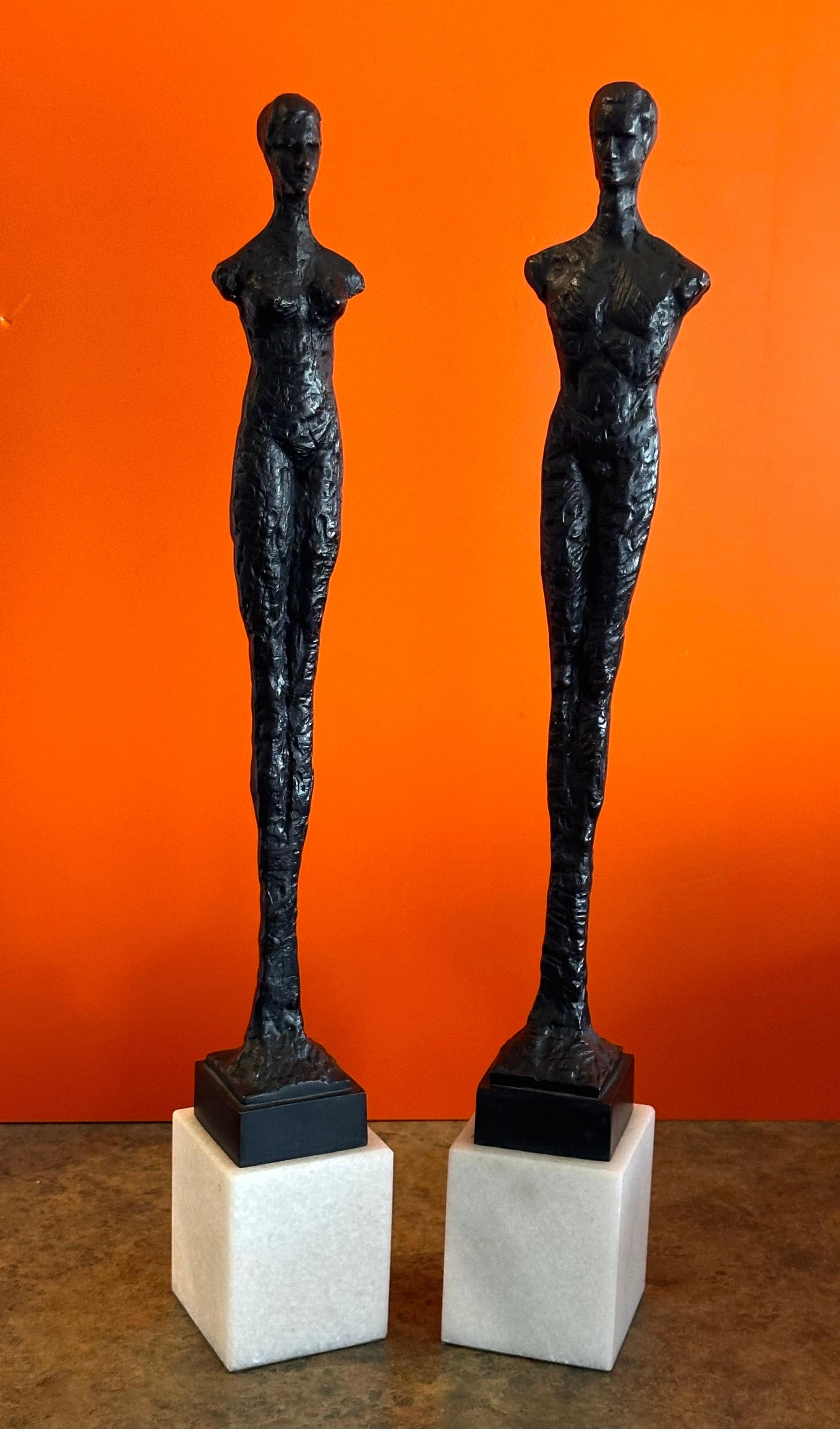 Cast Pair of Bronze Figurines on Marble in the Style of Alberto Giacometti