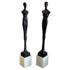 Pair of Bronze Figurines on Marble in the Style of Alberto Giacometti