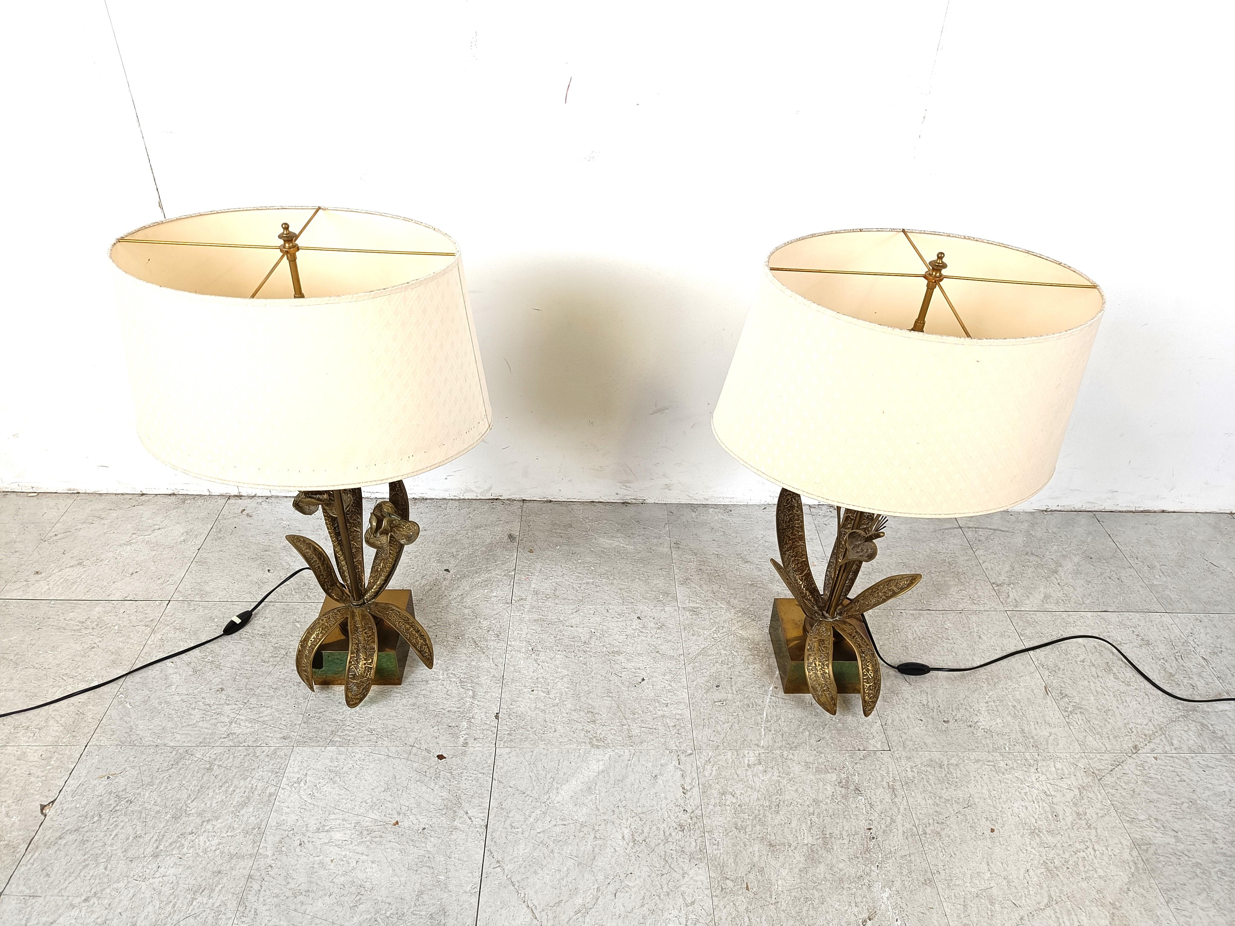 Vintage sculptural bronze flower lamps mounted on a brass base.

Come with the original lamp shades.

Beautiful original condition

The lamp has been sculpted with eye for detail just like the stunning maison charles lamps.

Works with regular