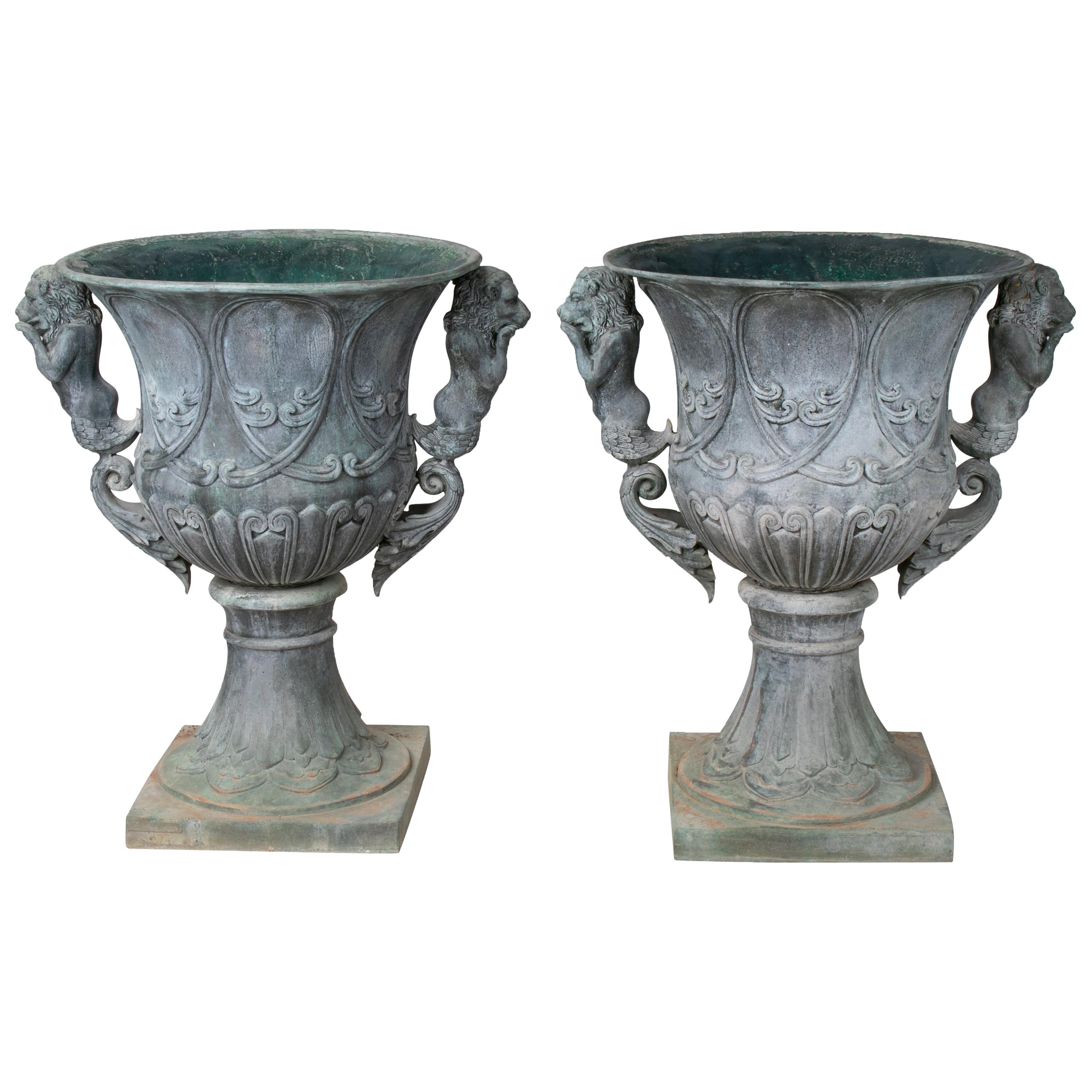 Pair of Bronze Garden Urns with Lions in Old Green Patina
