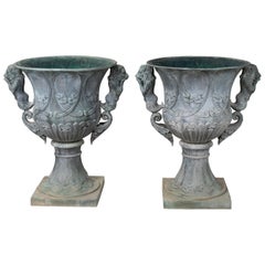 Pair of Bronze Garden Urns with Lions in Old Green Patina