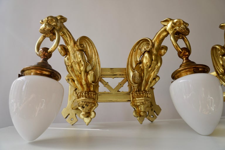 Pair of Bronze Gilt Wall Sconces Representing Two Griffins In Good Condition In Antwerp, BE