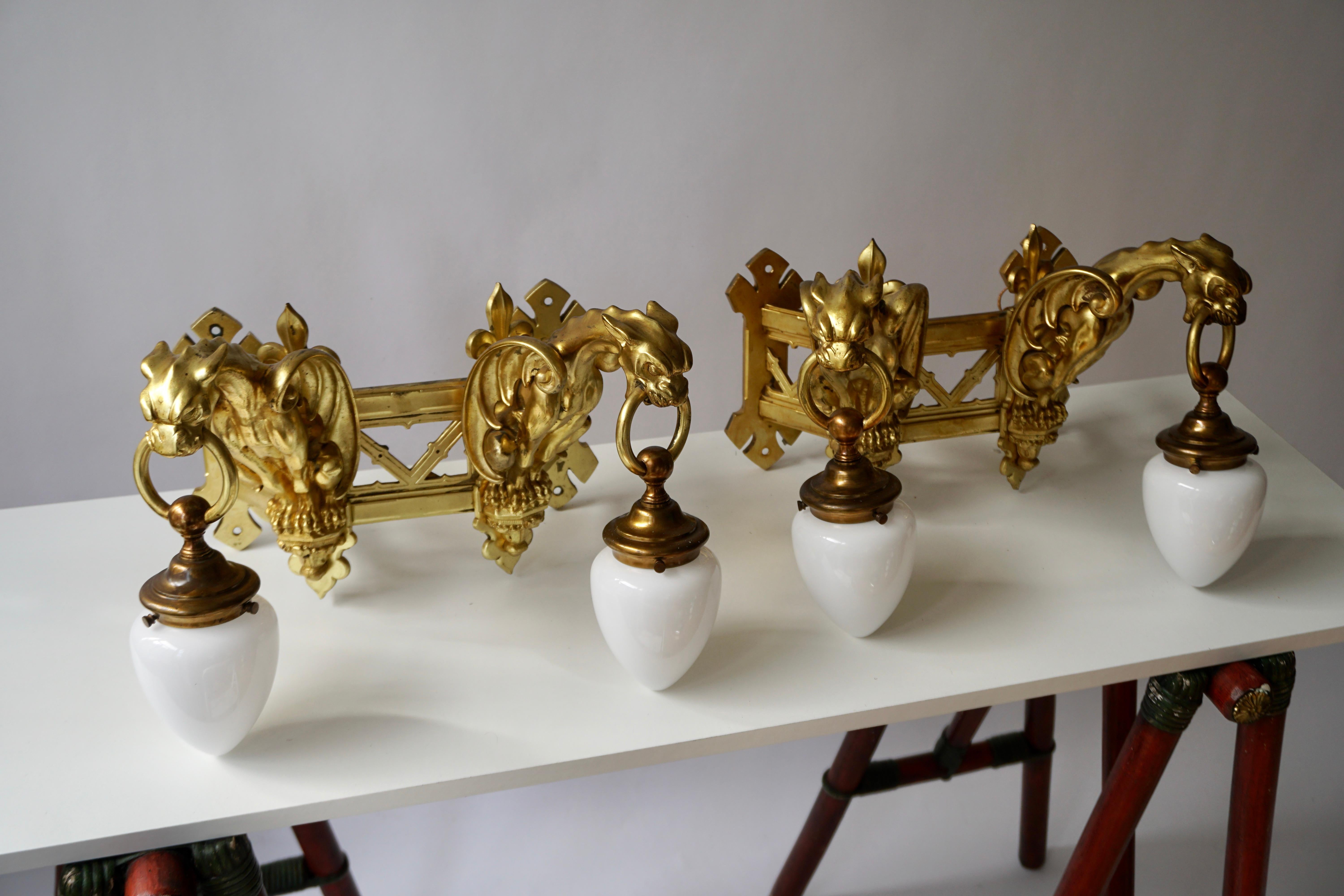 20th Century Pair of Bronze Gilt Wall Sconces Representing Two Griffins For Sale