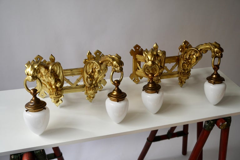 20th Century Pair of Bronze Gilt Wall Sconces Representing Two Griffins