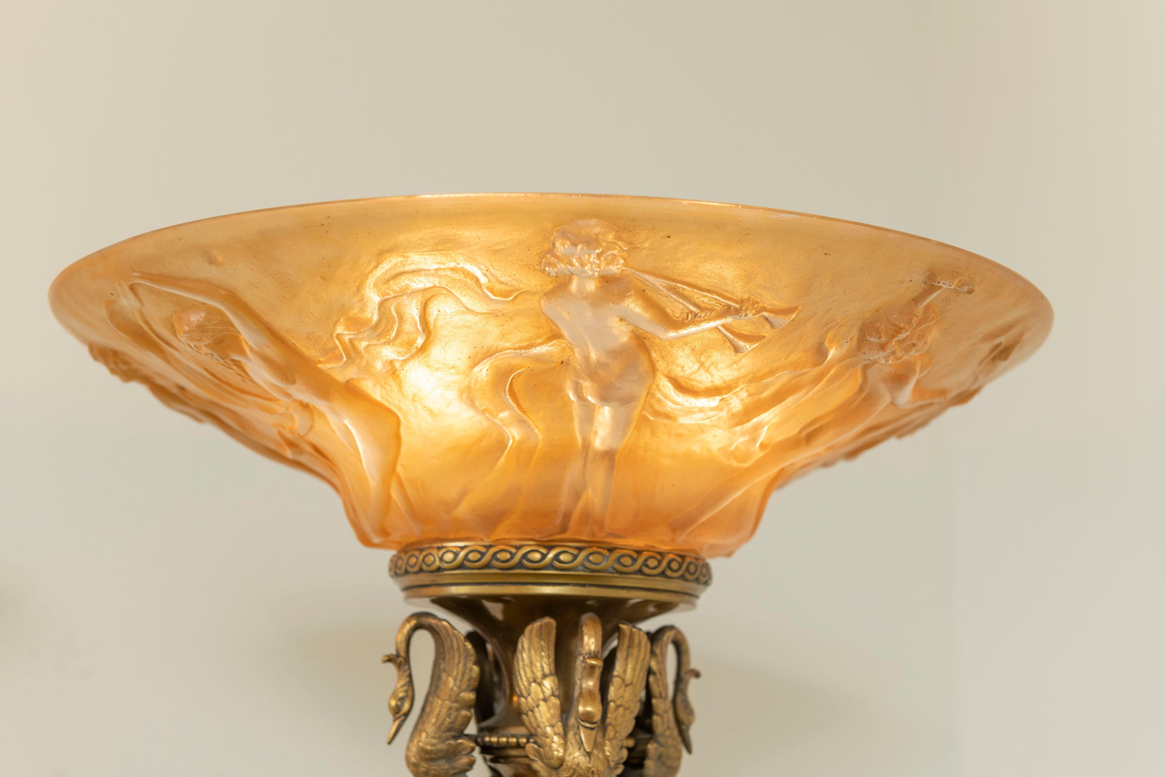 There is much to say about these remarkable lamps.
The metal work is finished in a polished bronze and the castings are a smorgasbord of fabulous detailed work that includes lions and swans. Besides that, work we urge you to look at all the other