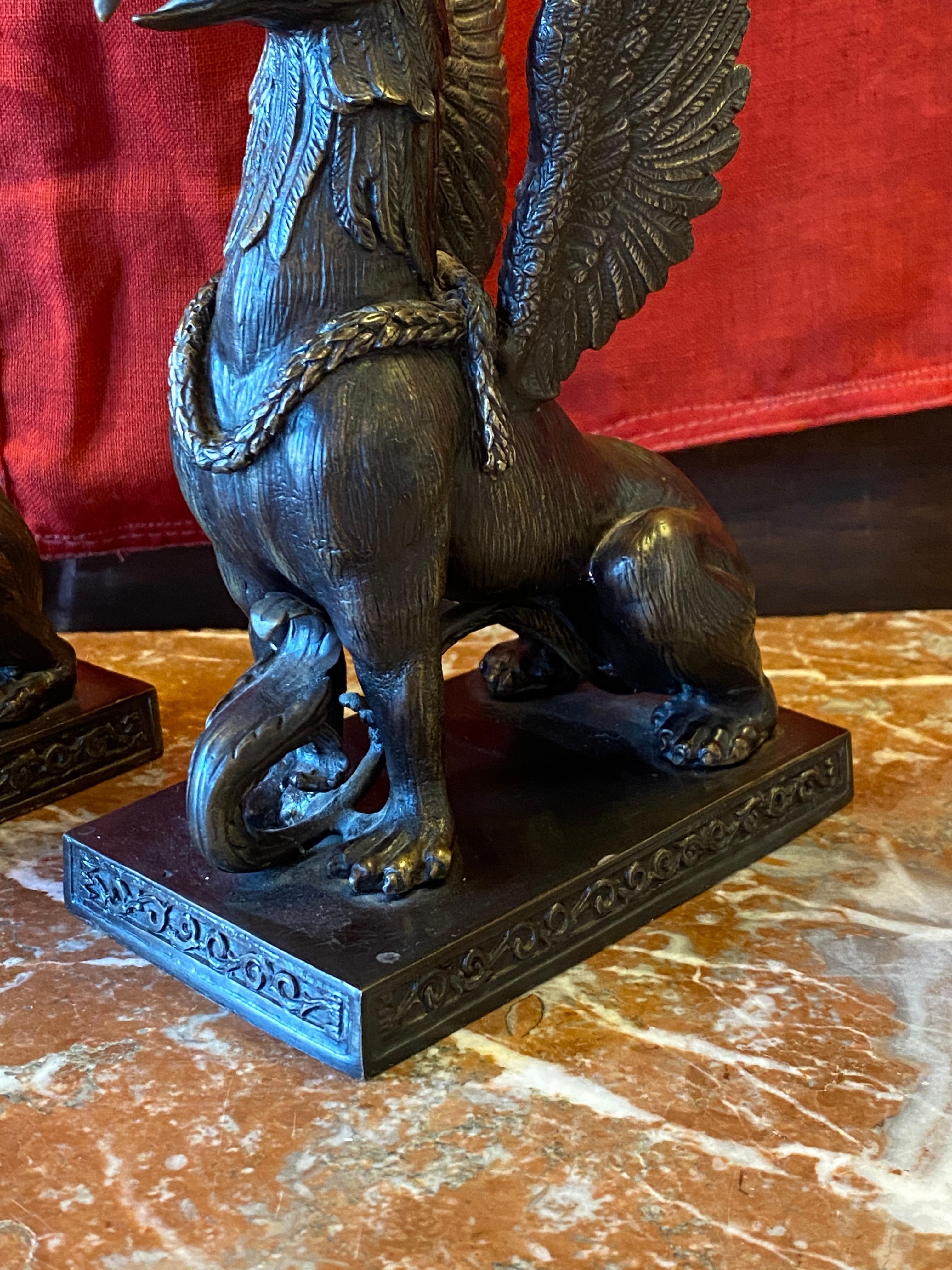 Neoclassical Pair of Bronze Griffin form Candle Holders