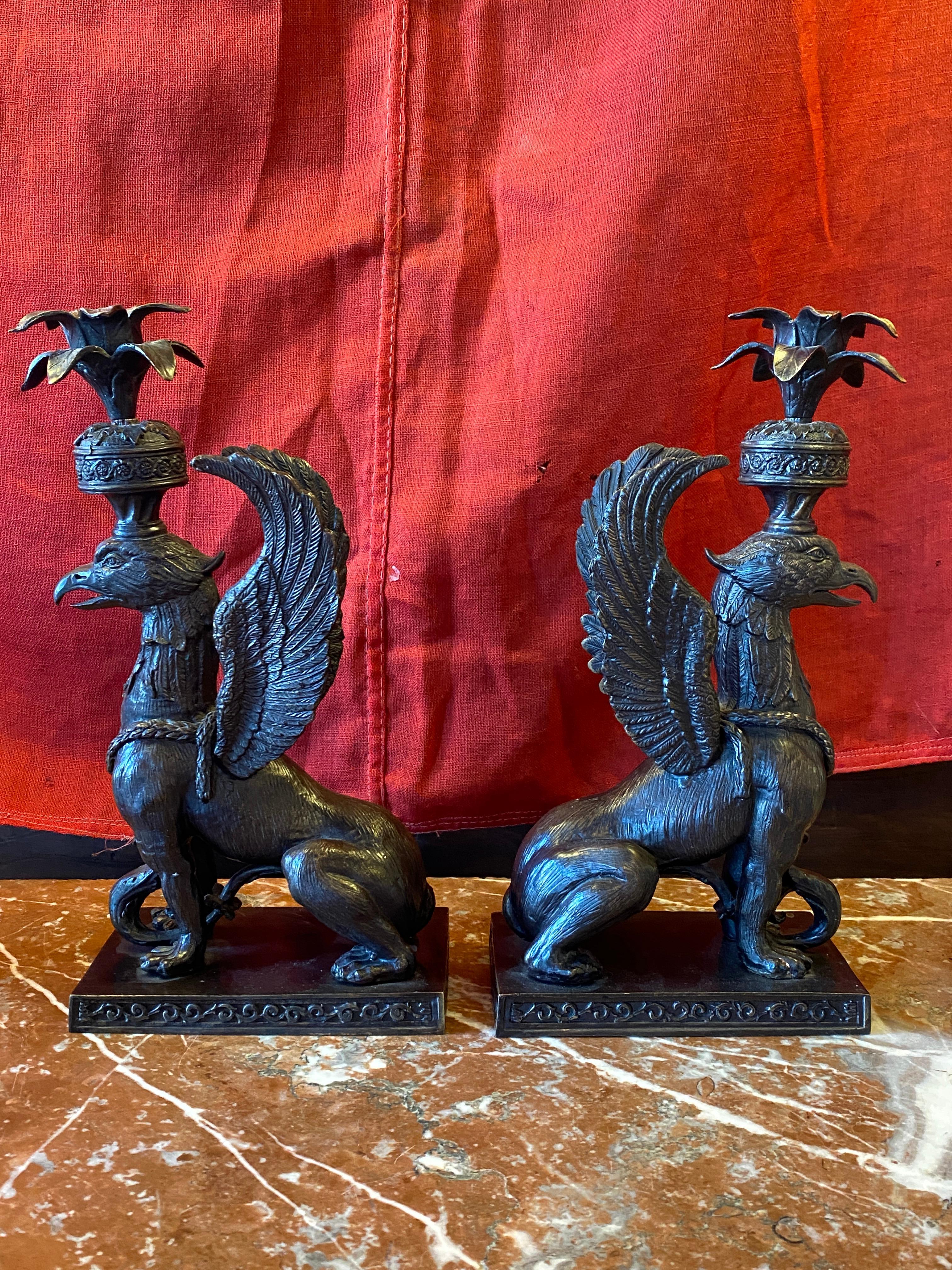 Patinated Pair of Bronze Griffin form Candle Holders