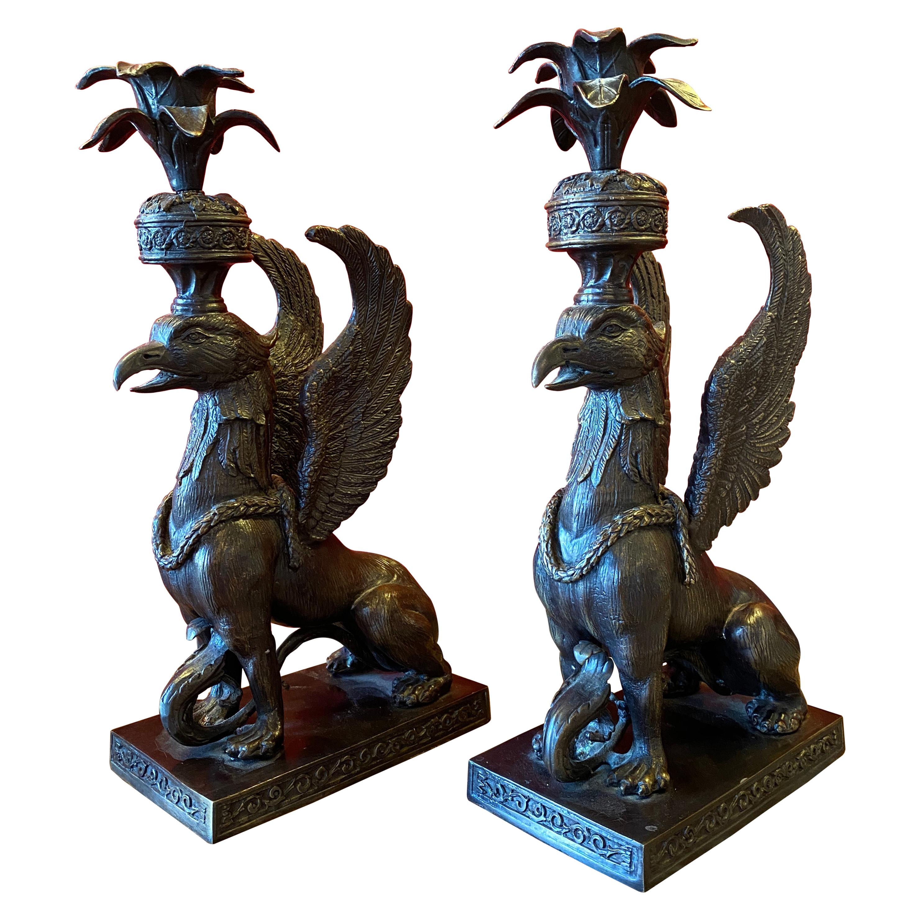 Pair of Bronze Griffin form Candle Holders