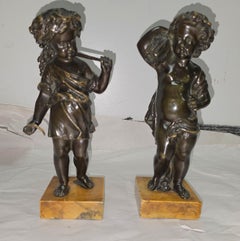 Pair of Bronze Harvest Putti Cherub Figures on Marble Plinth.
