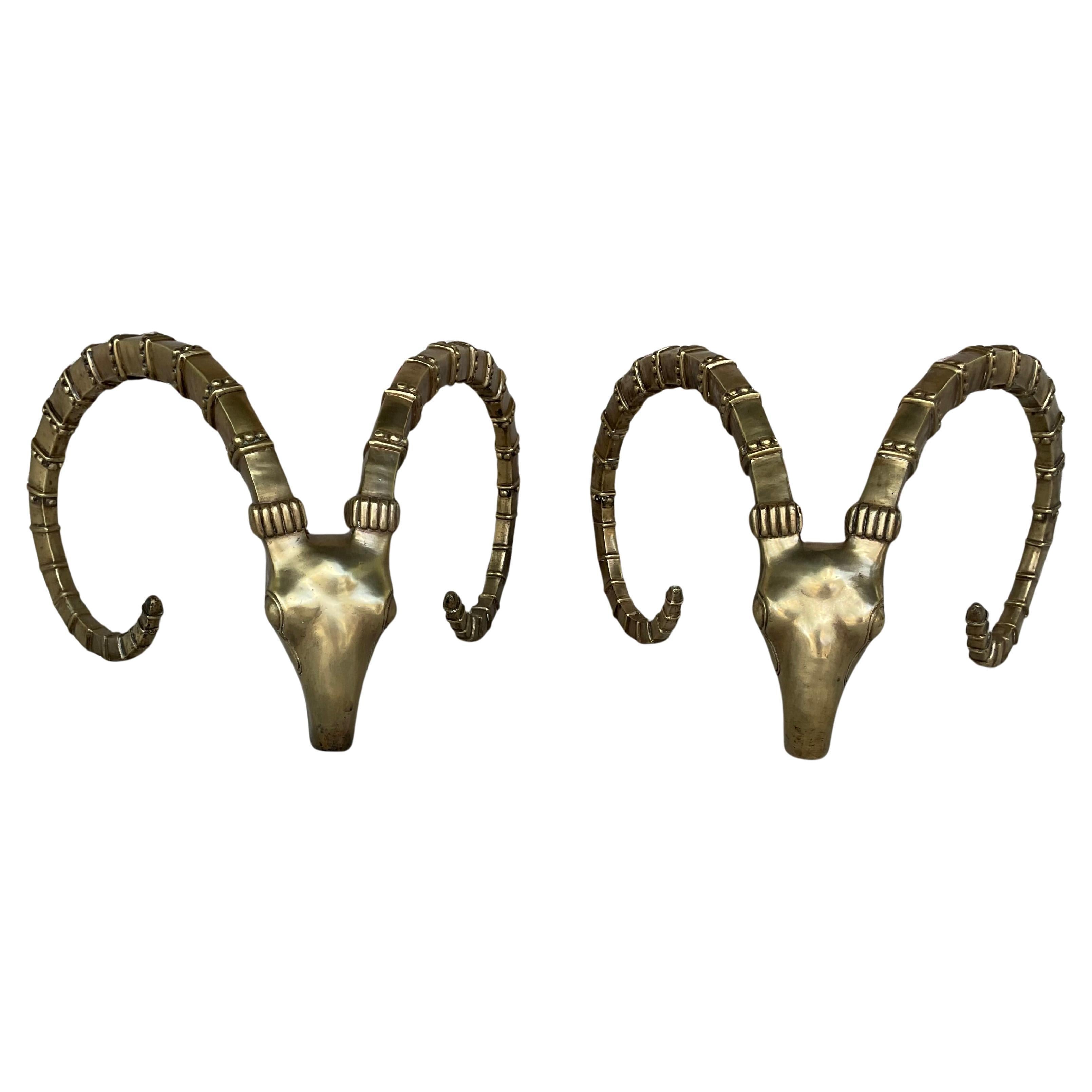 Pair of bronze ibex head coffee table bases attributed to the iconic French designer Alain Chervet.  These are beautiful sculptural pieces as stand alone art, but are also functional bases for a table. These sculptures have been featured in various