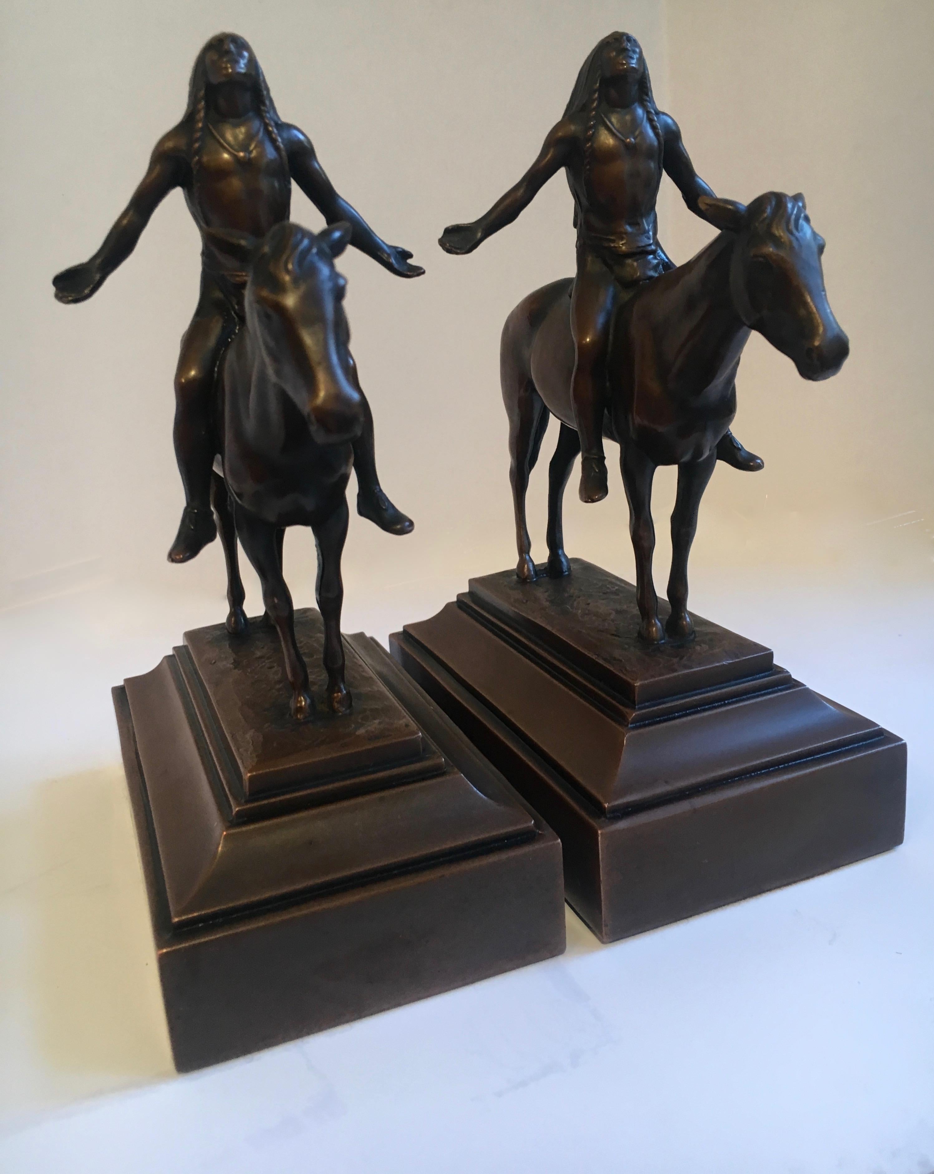 Pair of bronze Indian horse bookends, a handsome pair. Perfect to wrangle your books - an Indian on horseback.  The pair are in reference to the Cyrus Dallin 