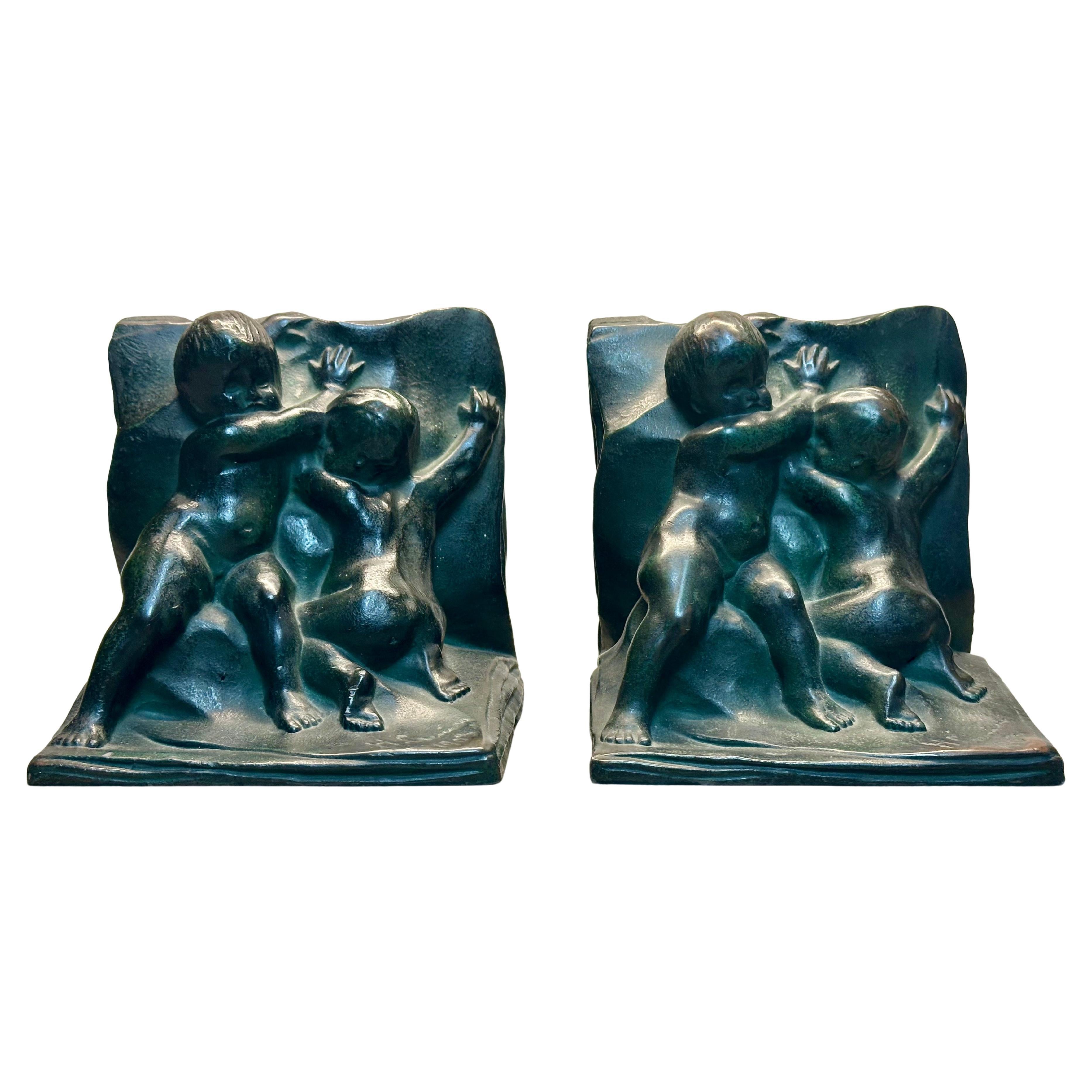 Pair of Bronze "Infants on Book" Bookends Signed by Henri Crenier for NAL Co. For Sale