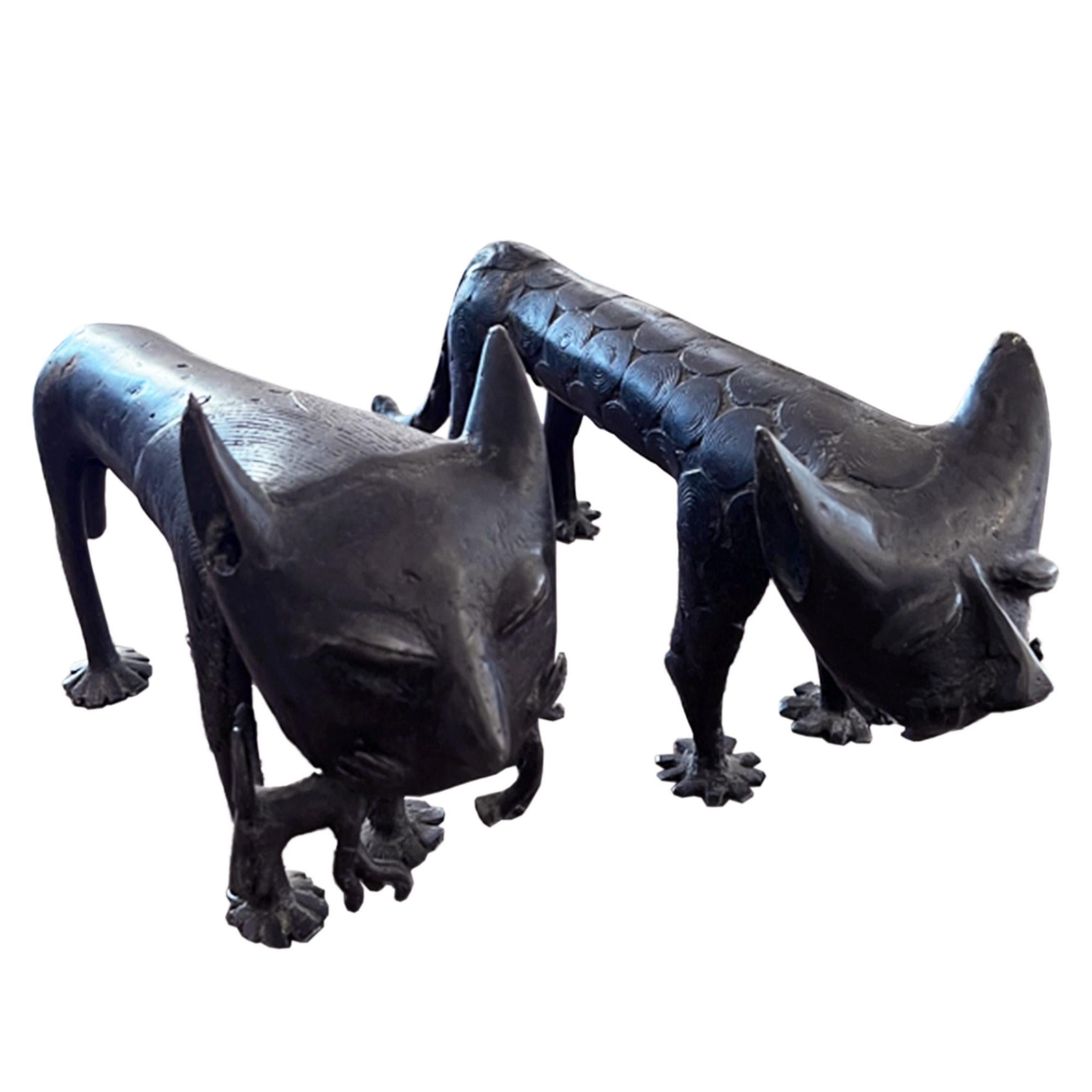 This is a great pair of Benin style bronze sculptures. Each lion displays great character and incredible detail, please have a look at all our photographs for a closer look.

The male lion has a small antelope in his jaws and the female is clearly