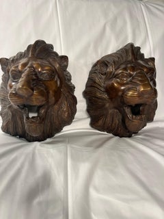 Pair of bronze lion wall sculptures dating back to the 1900s