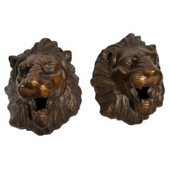 Pair of bronze lion wall sculptures dating back to the 1900s
