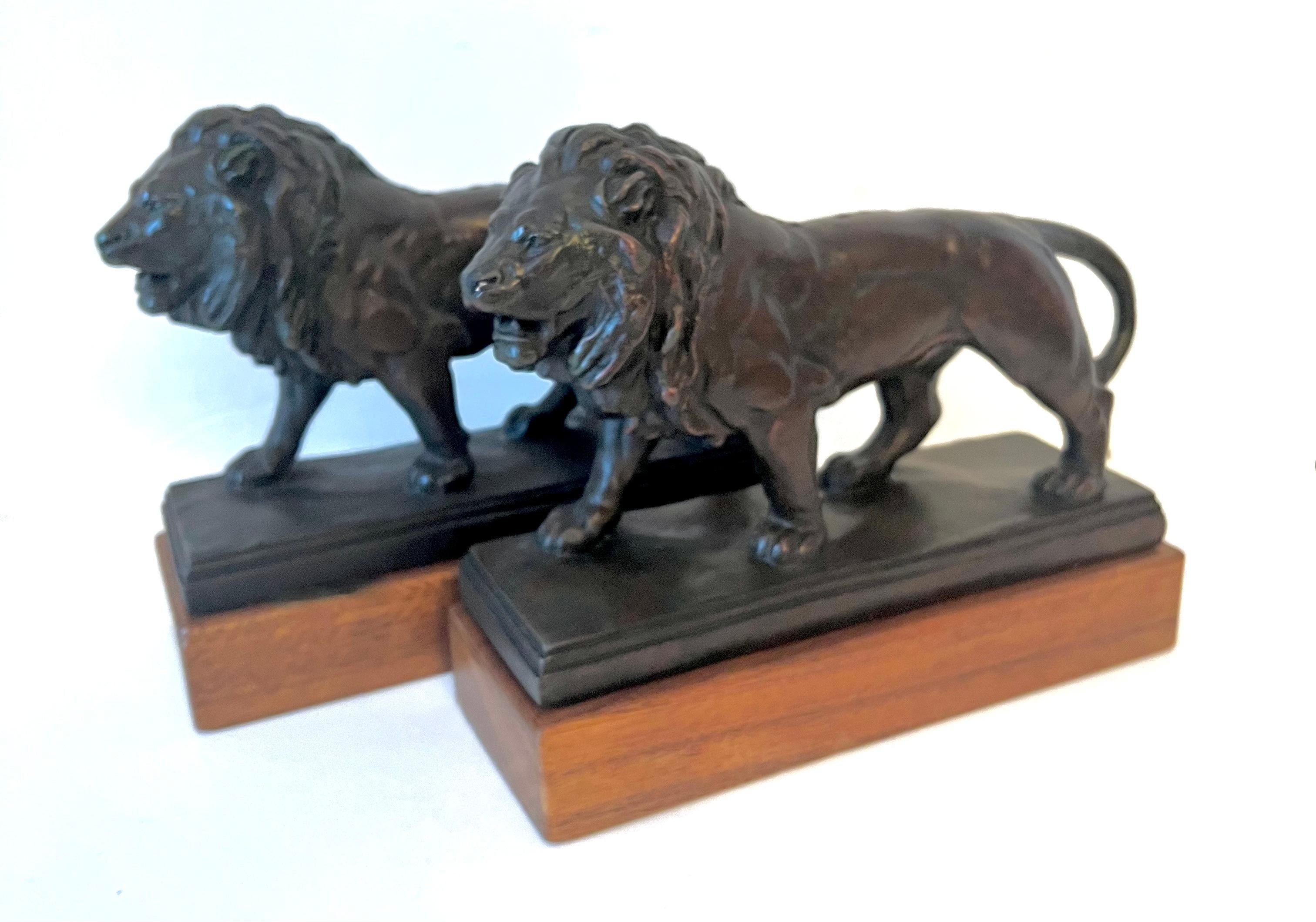 Pair of Bronze Lions on Wood Base In Good Condition In Los Angeles, CA