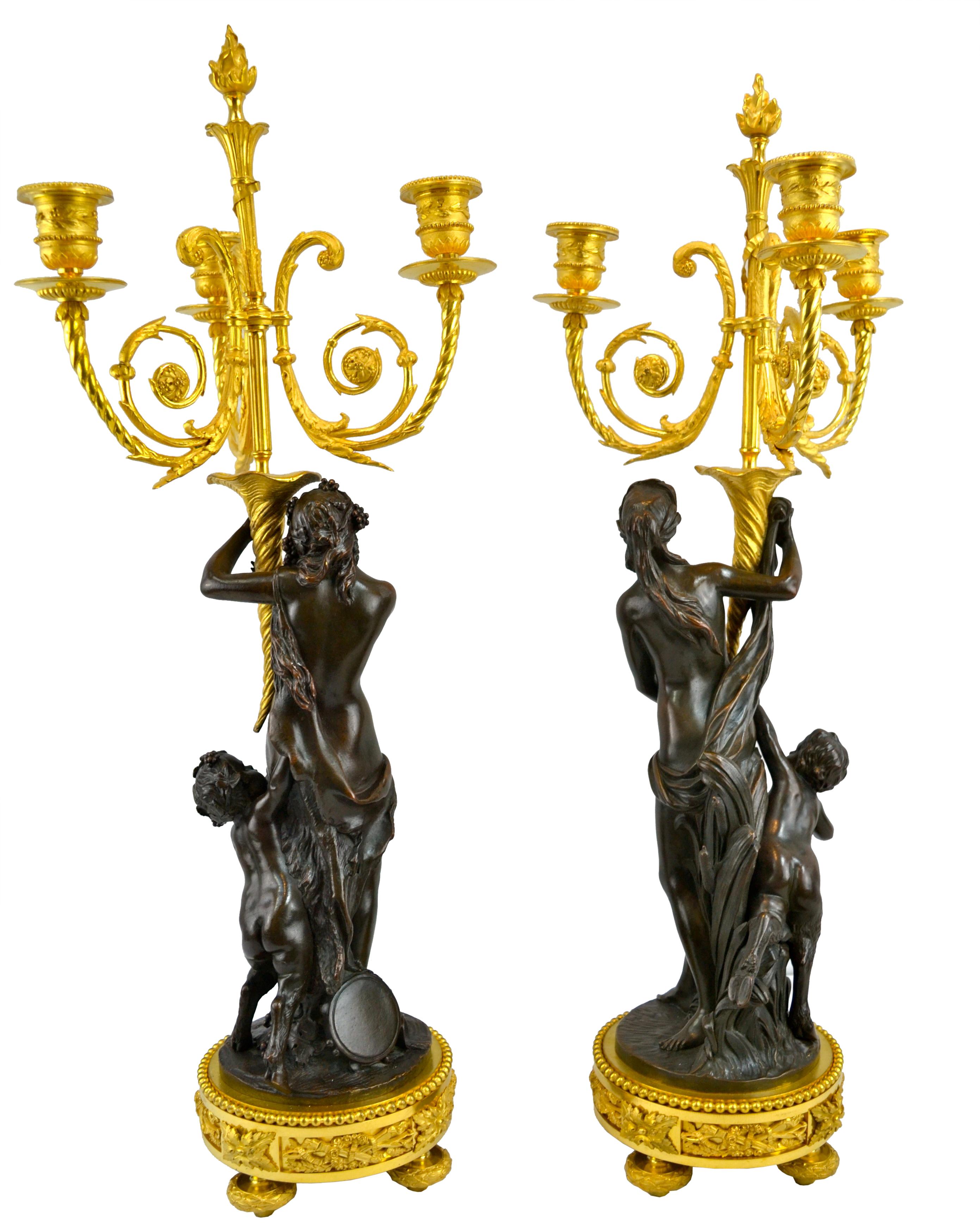 Patinated Pair of Bronze French Louis XVI Style Figural Candelabra After Clodion For Sale