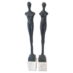 Pair of Bronze Male and Female Bronze Sculptures in the Style of Giacometti 