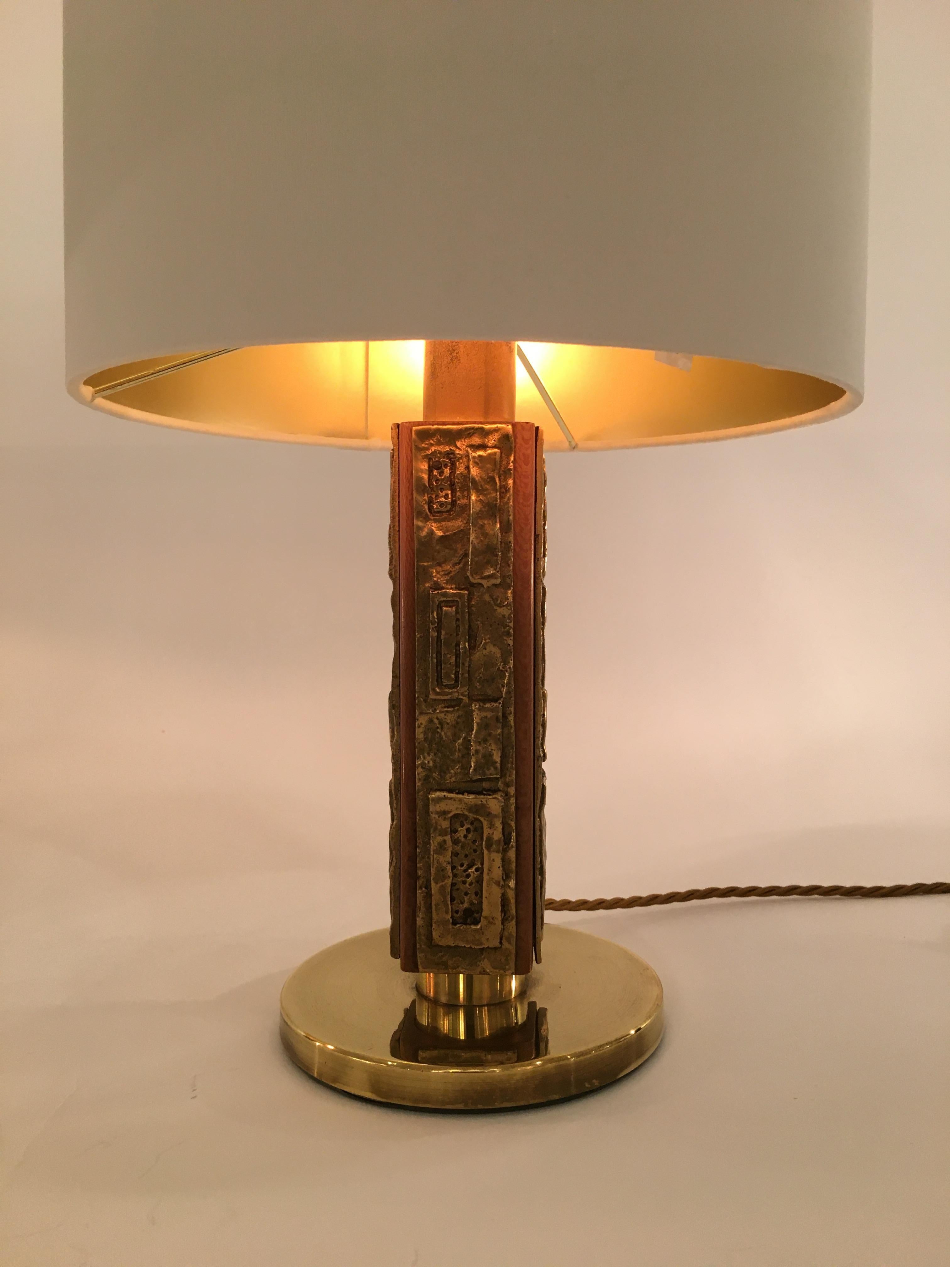 A fabulous pair of 1970s bronze, brass and walnut table lamps designed by Angelo Brotto for the Italian company, Esperia, circa 1970. The principal body of the 'Margot' lamp is formed from a rectangular cylinder with rounded edges and is made of