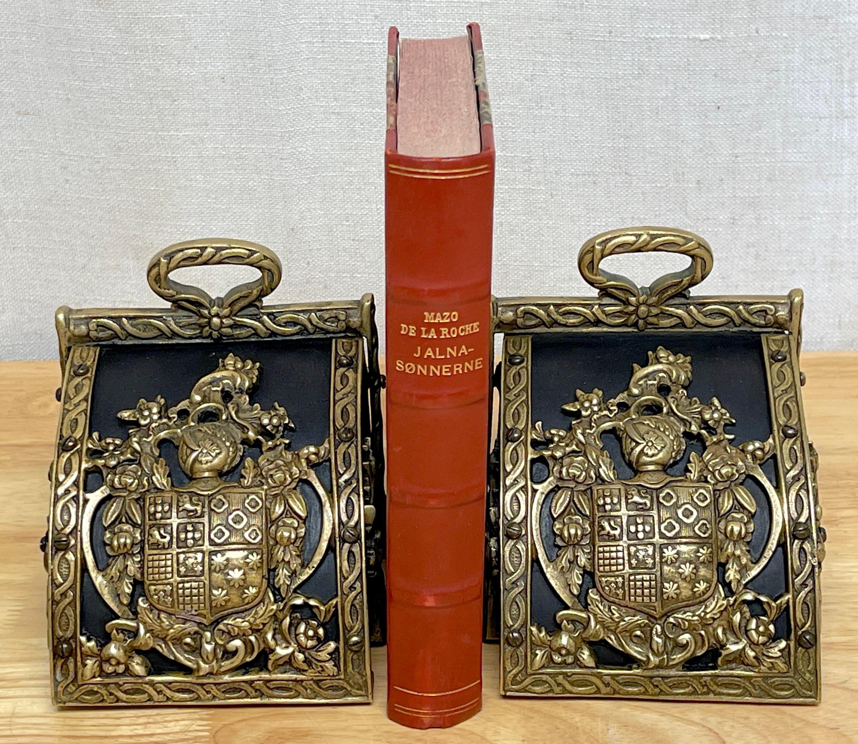 Sporting Art Pair of Bronze Mounted Armorial Motif Ebonized Wood Stirrup Motif Bookends