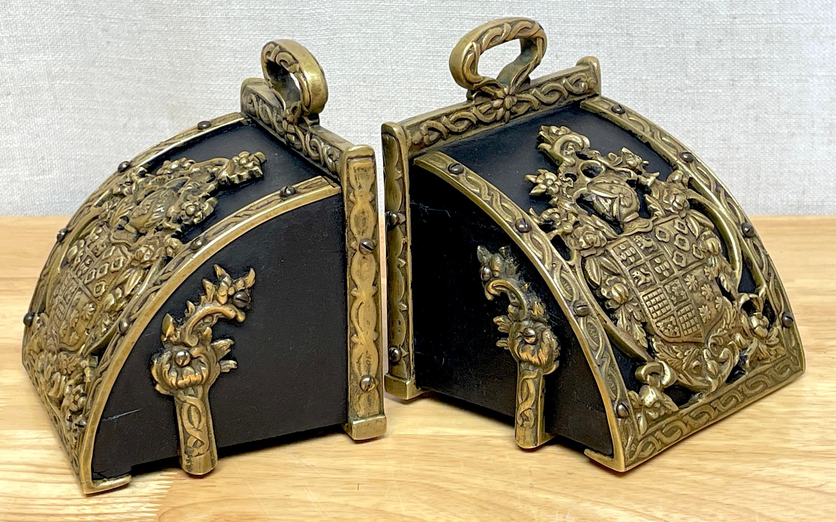 Cast Pair of Bronze Mounted Armorial Motif Ebonized Wood Stirrup Motif Bookends  For Sale