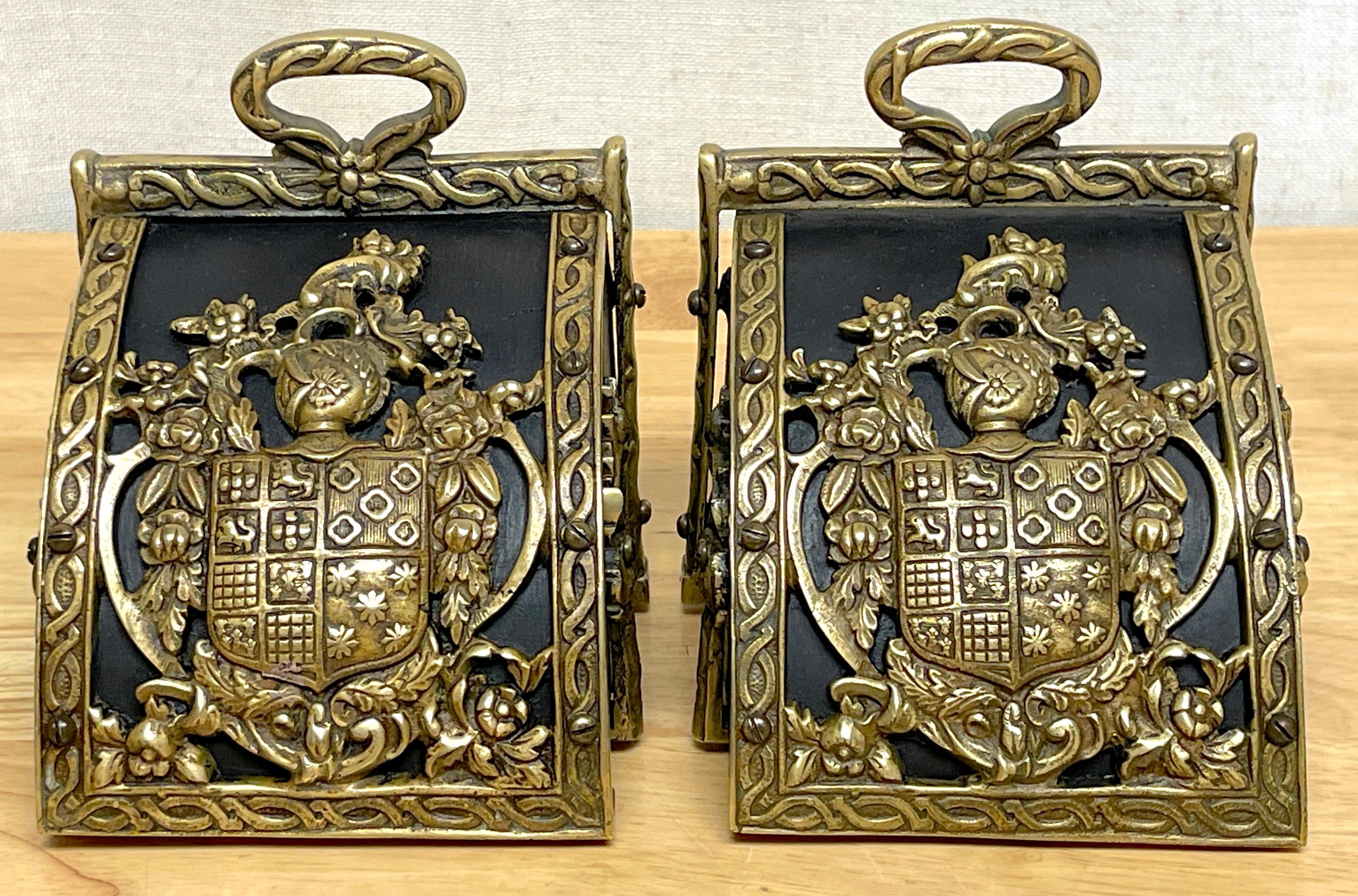 20th Century Pair of Bronze Mounted Armorial Motif Ebonized Wood Stirrup Motif Bookends  For Sale