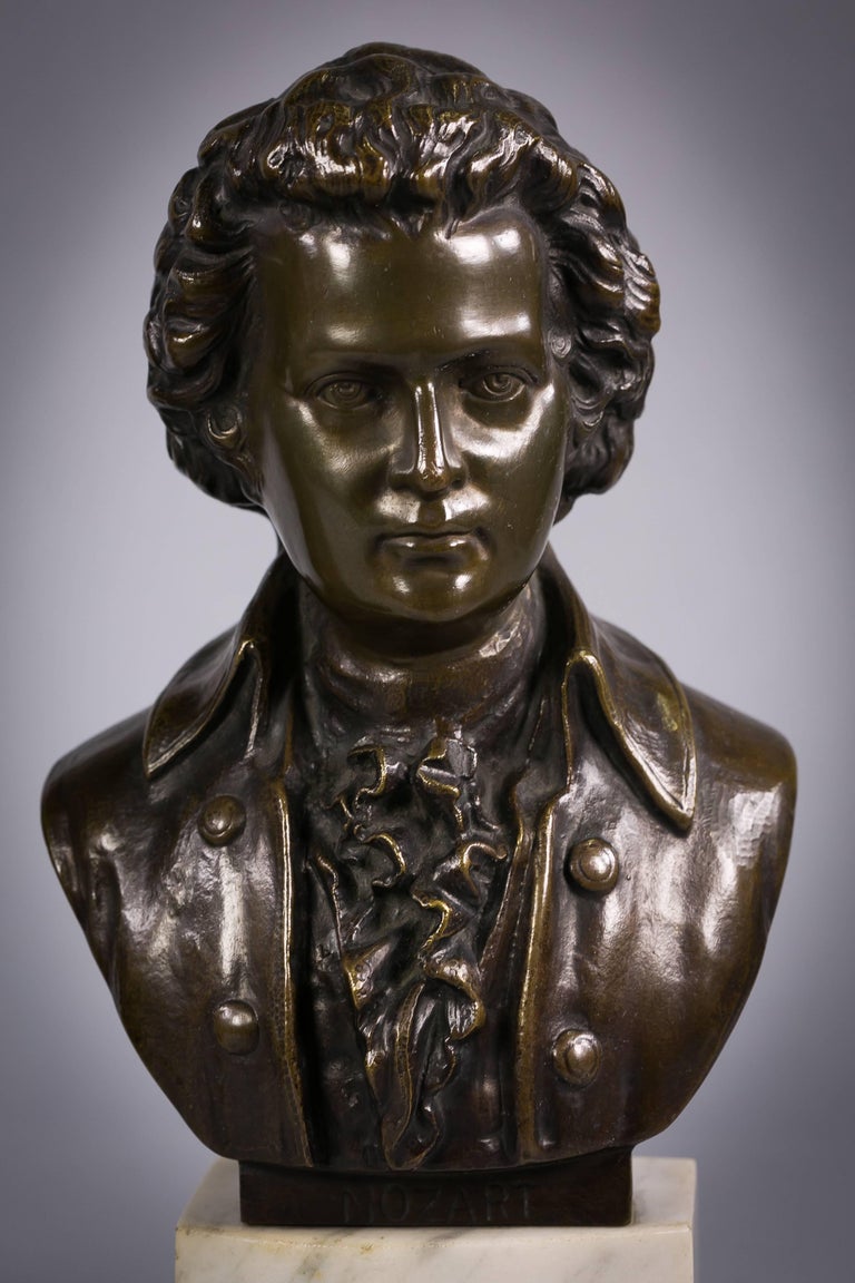 Pair of bronze-mounted busts of Beethoven and Mozart on marble stands, circa 1880.