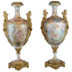 Pair of Bronze Mounted Sèvres Style Polychrome and Gilt Porcelain Vases w Covers